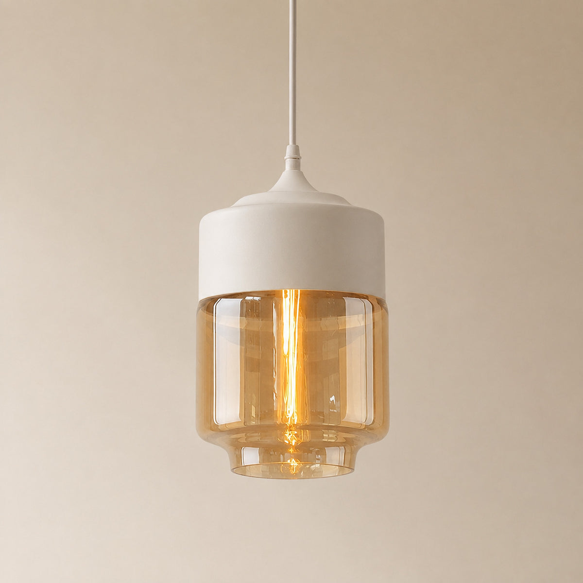 Alge glass pendant with a white cap and an amber glass shade, a shorter, wider upright cylinder measuring 28 by 18 cm