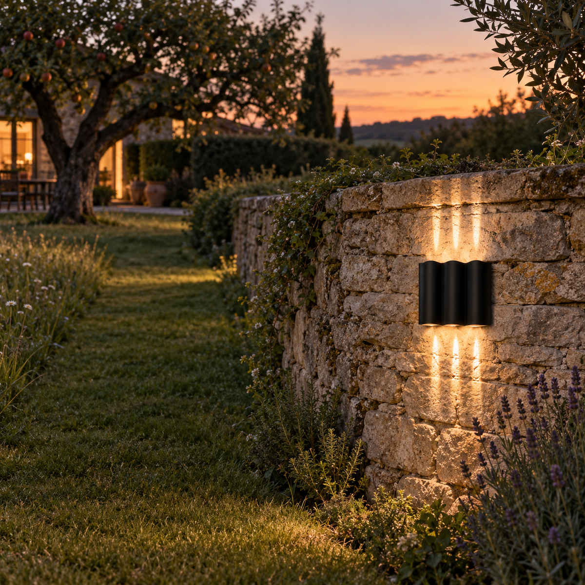 Almeida wavy aluminum outdoor wall light, cool white, in a long garden.
