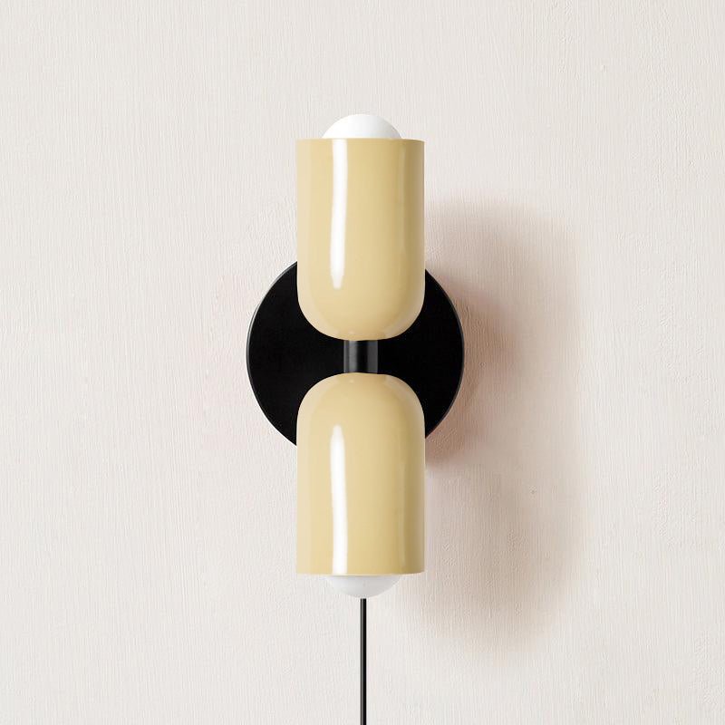 Alvor wall sconce in beige painted metal, both up and down shades shown from the front