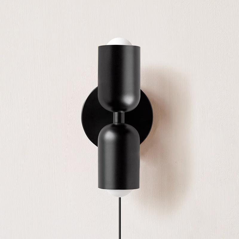 Alvor wall sconce in black painted metal, both up and down shades shown from the front