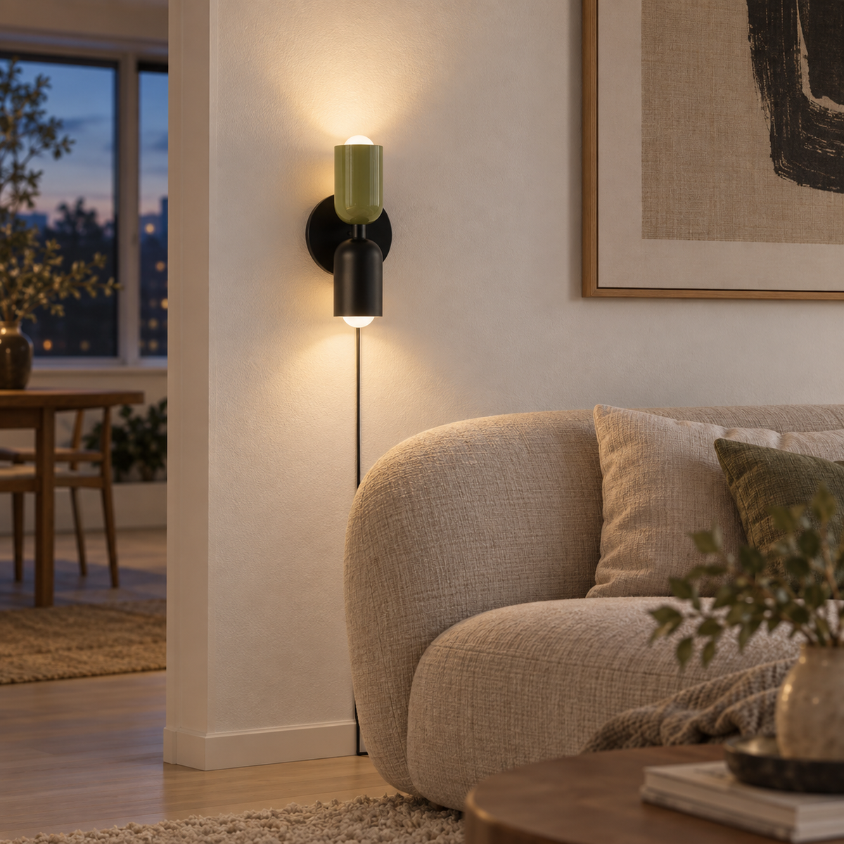 Alvor up-and-down plug-in wall sconce in green, in a living room.