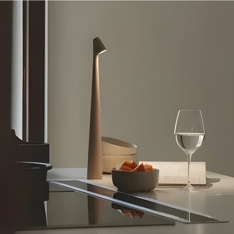 Slim cordless mood lamp on a desk in a home office.