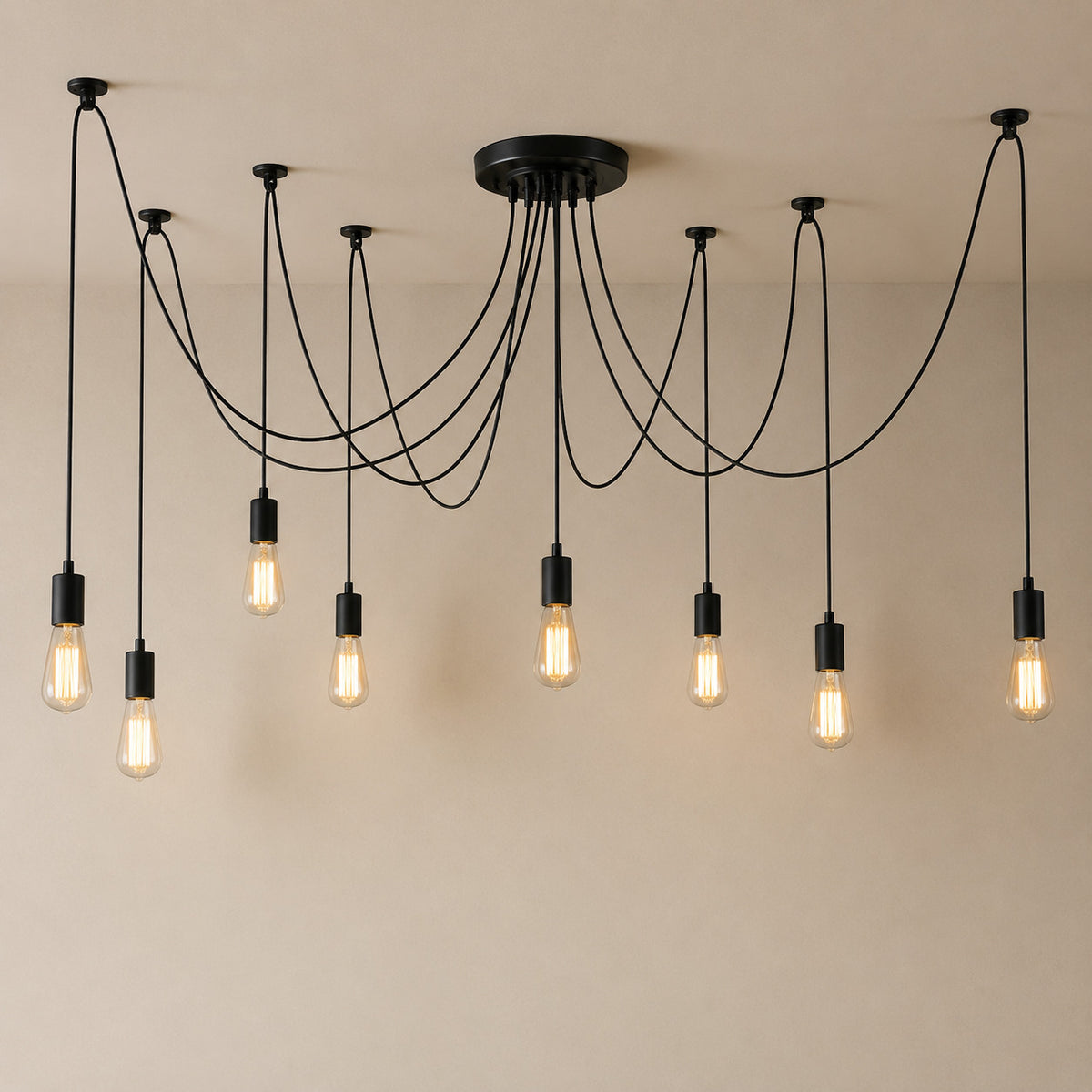 Anadia spider chandelier in matte black, 8 cable version, eight bare Edison bulbs on one ceiling plate