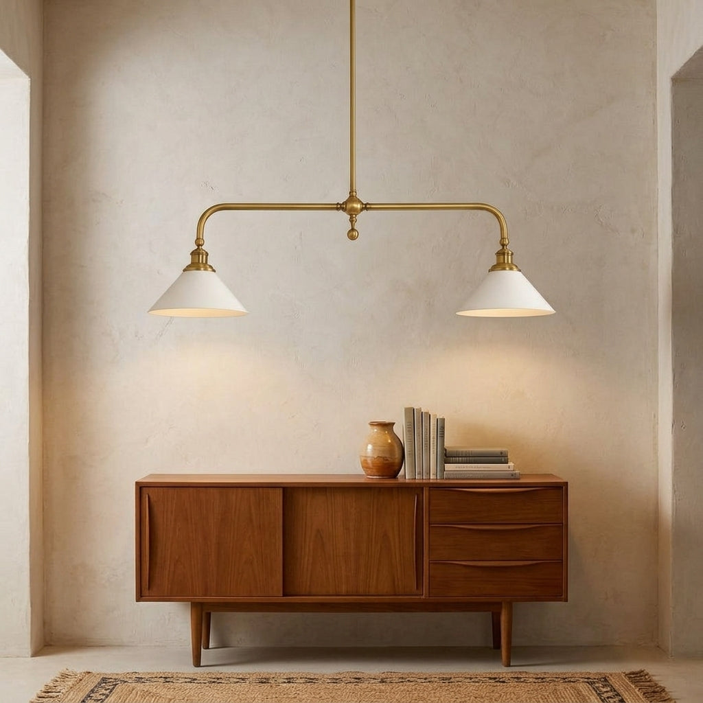 Ardila linear pendant with an aged brass bar and two white aluminium shades, above a wood sideboard
