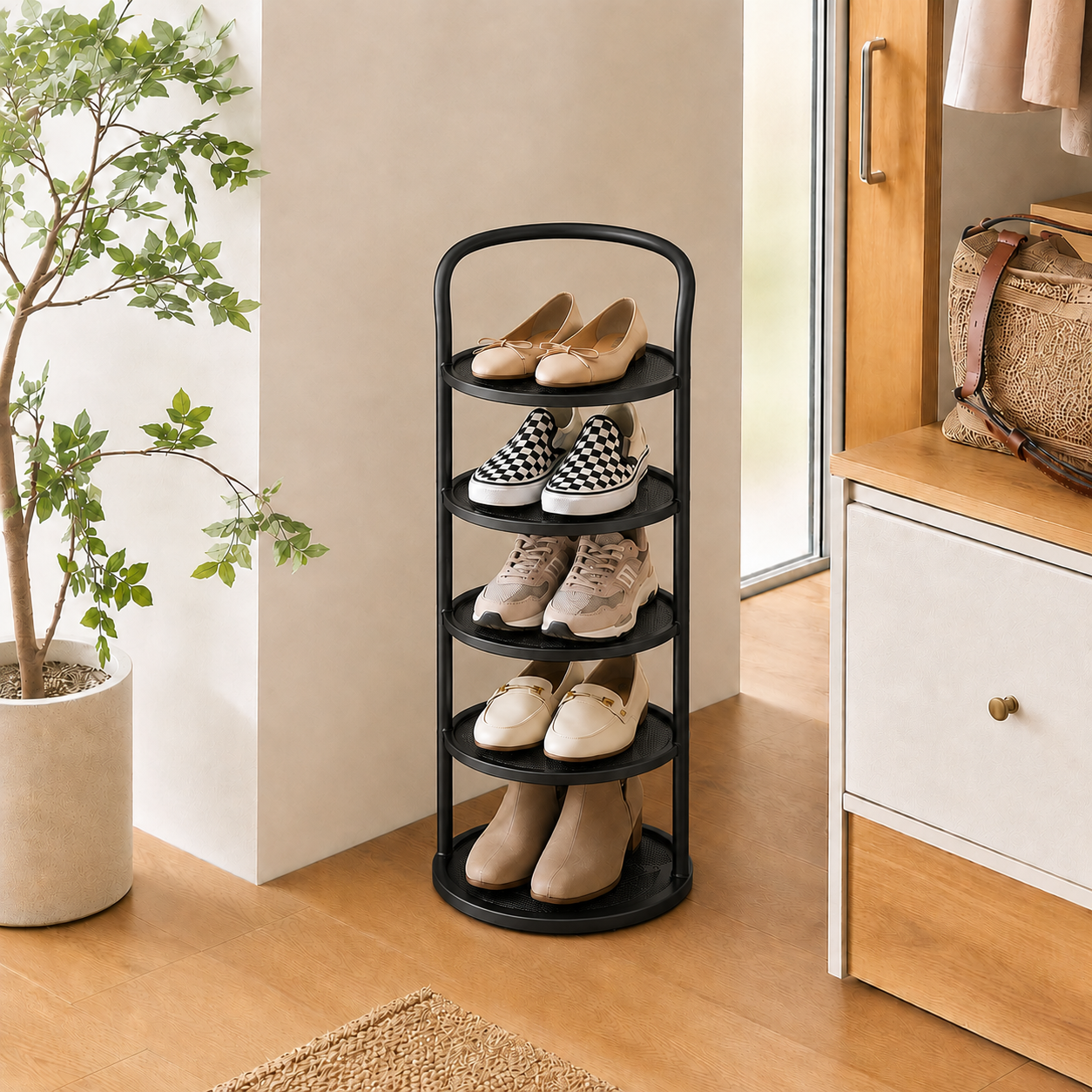 Black 5-tier Arribada shoe storage rack in entryway with potted plant and woven rug