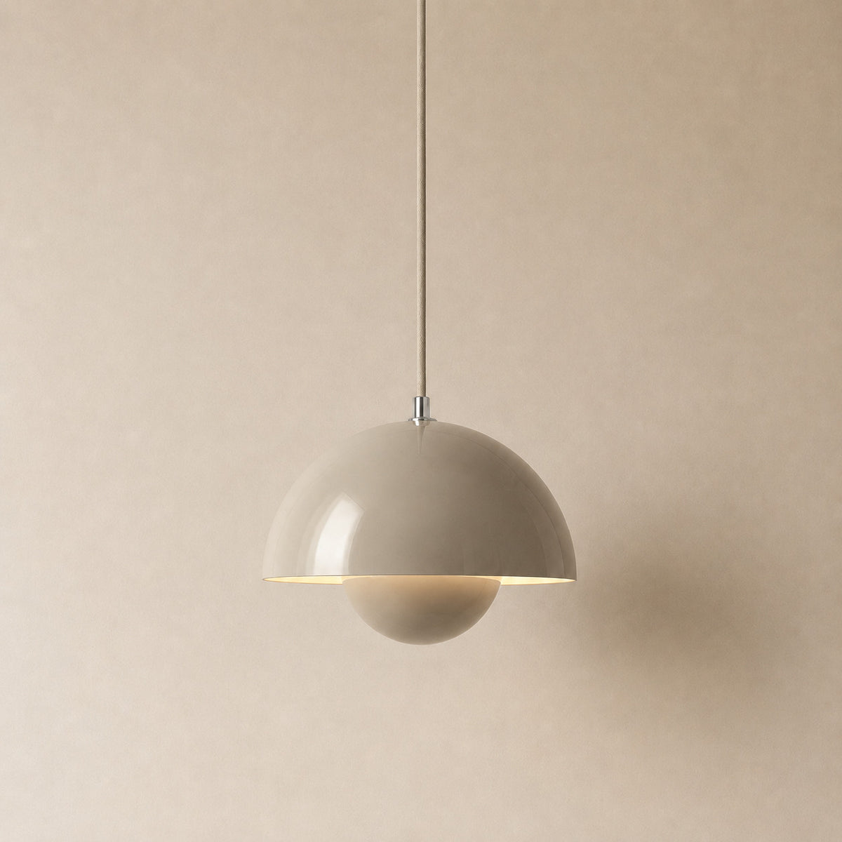 Ave hemisphere pendant in beige gray on a matching fabric cord, 16 cm tall