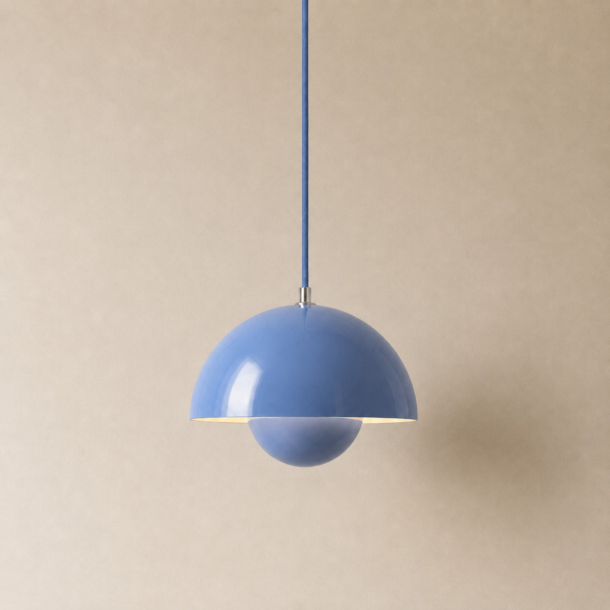 Ave hemisphere pendant in blue on a matching fabric cord, 16 cm tall
