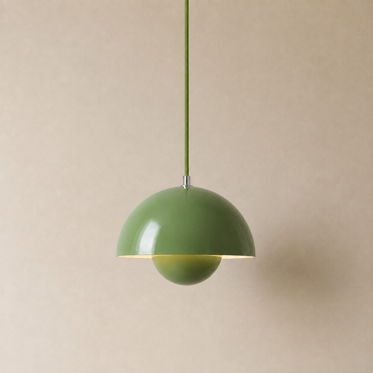 Ave hemisphere pendant in green on a matching fabric cord, 16 cm tall
