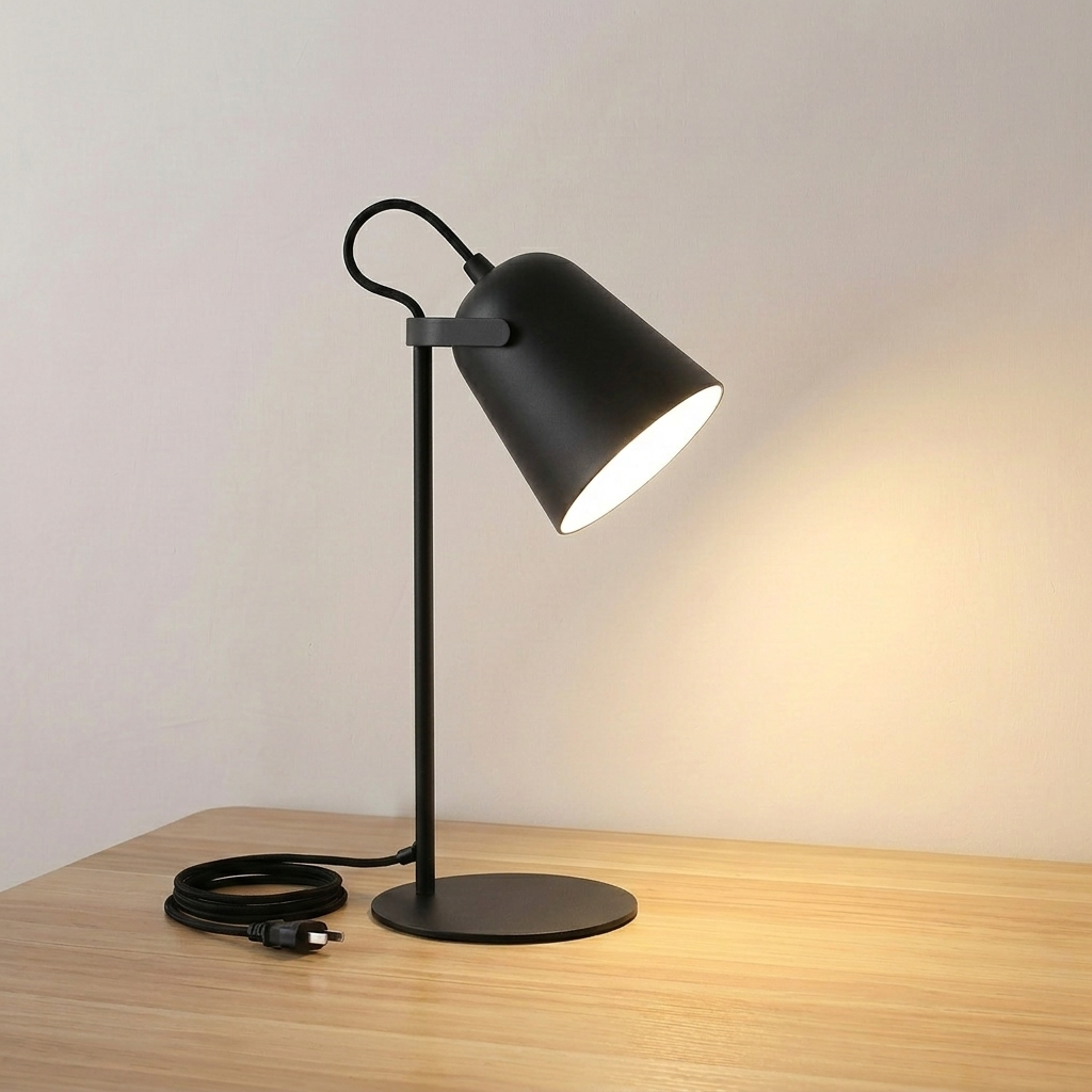 Iron bucket table lamp in black with tilting shade head, product shot.