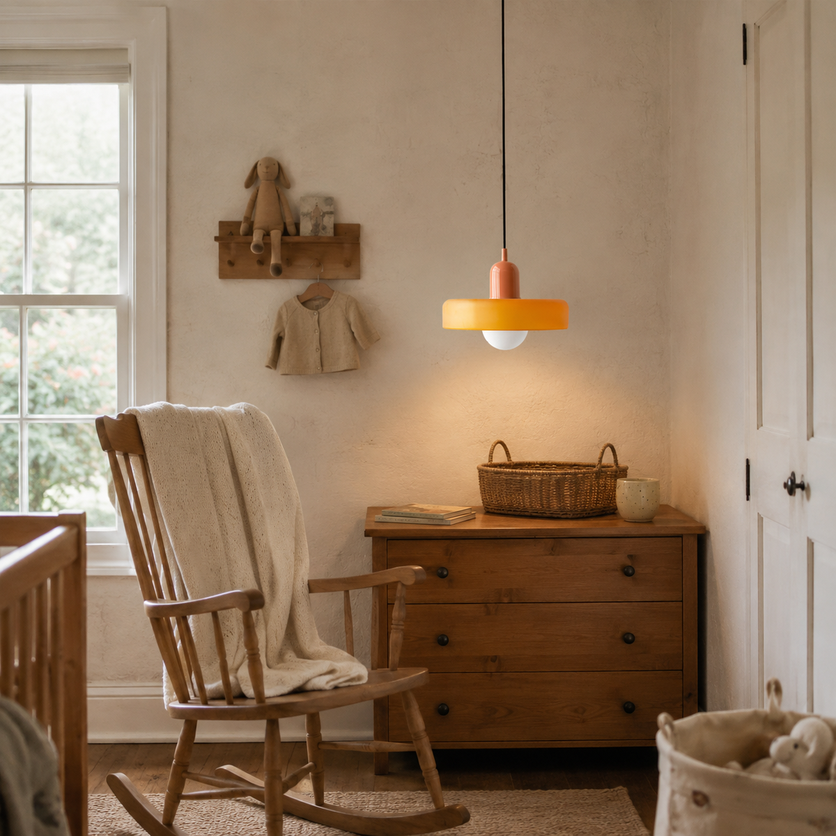 Bragança disc and globe pendant light in green, in a nursery.