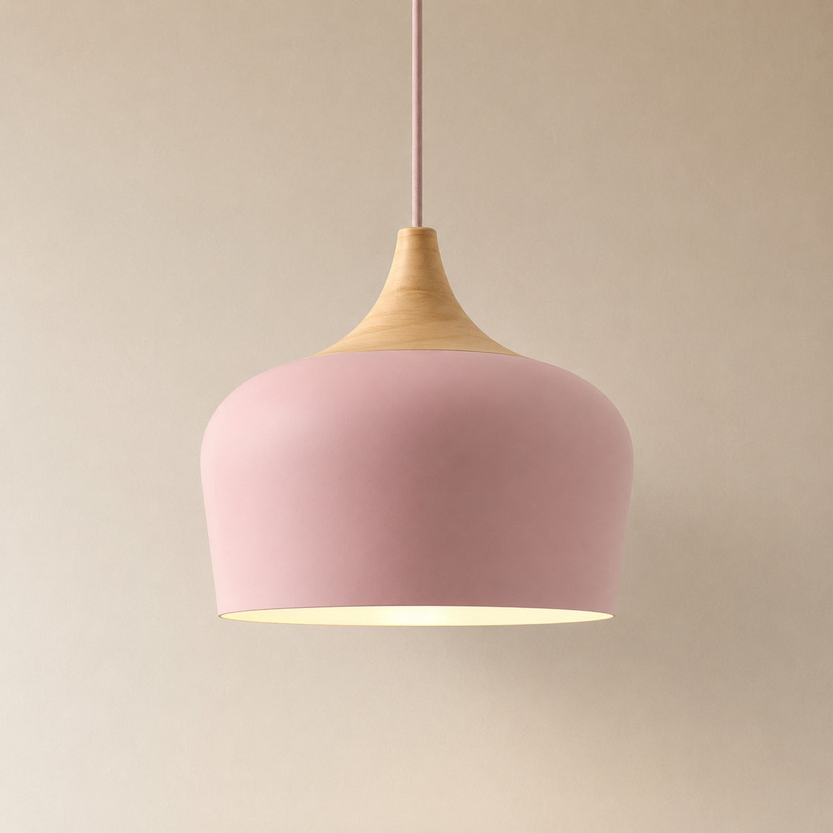 Cobres pendant in soft rose pink with a turned wood cap, the deeper Dome shade
