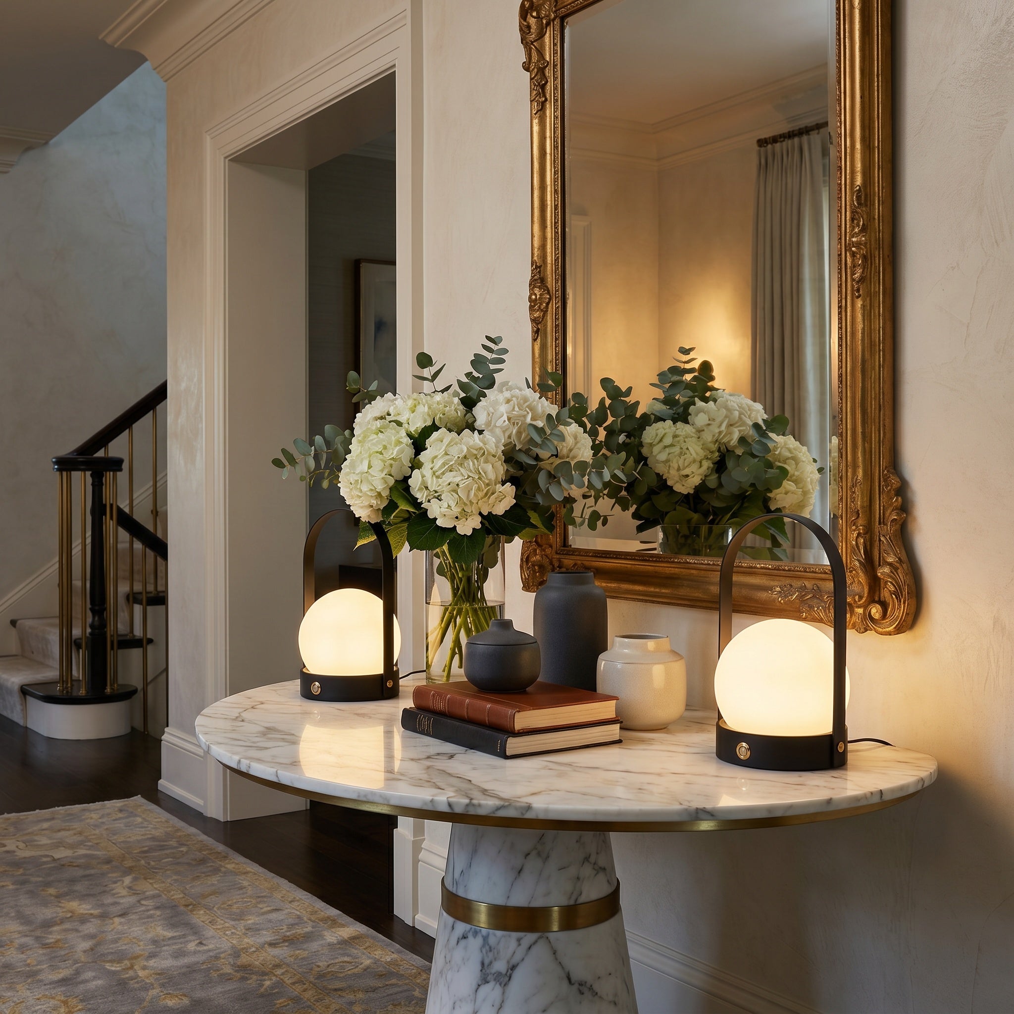 Cordless touch table lamp glowing on a wooden console table.