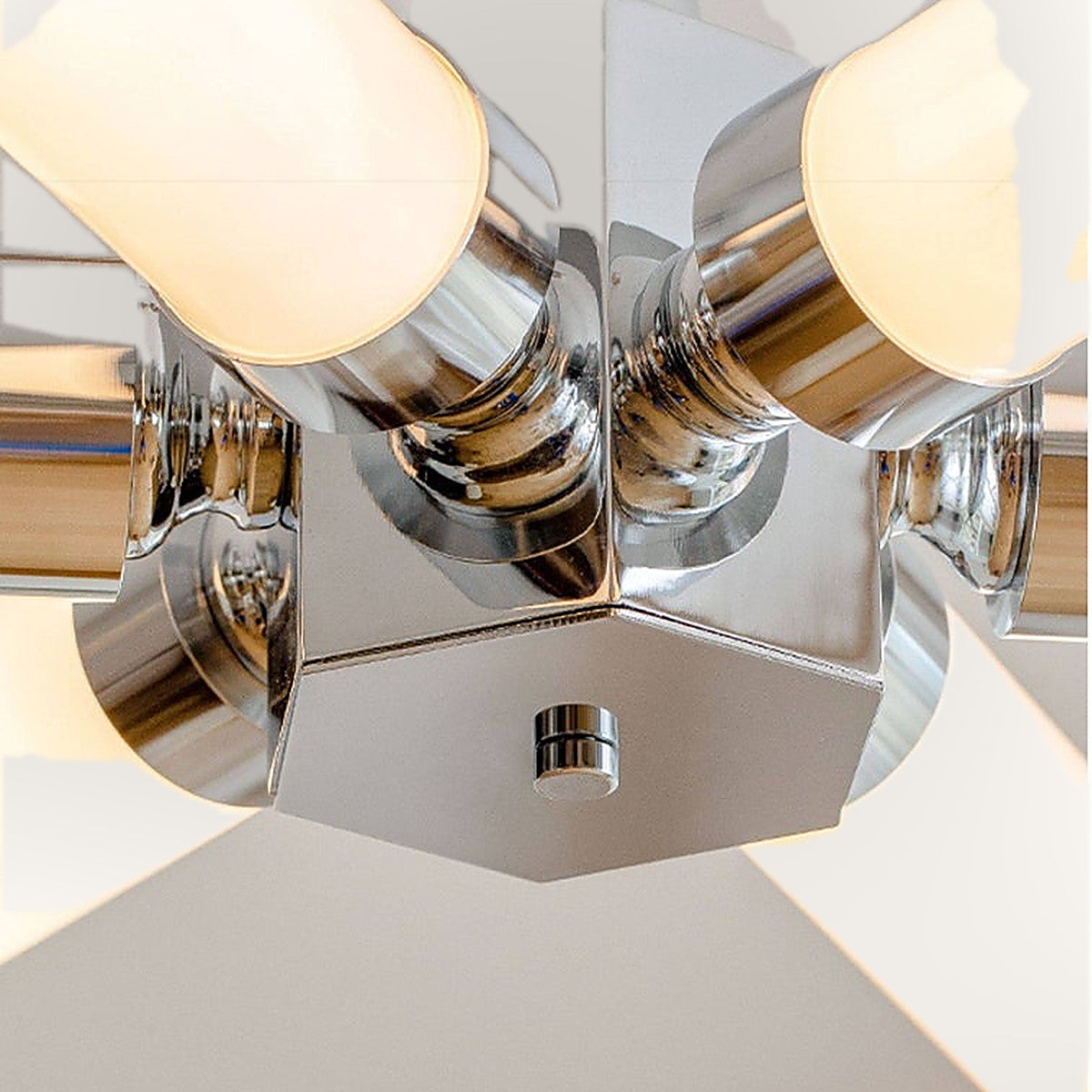 Douro starburst ceiling light, the chrome hub where the six arms meet.