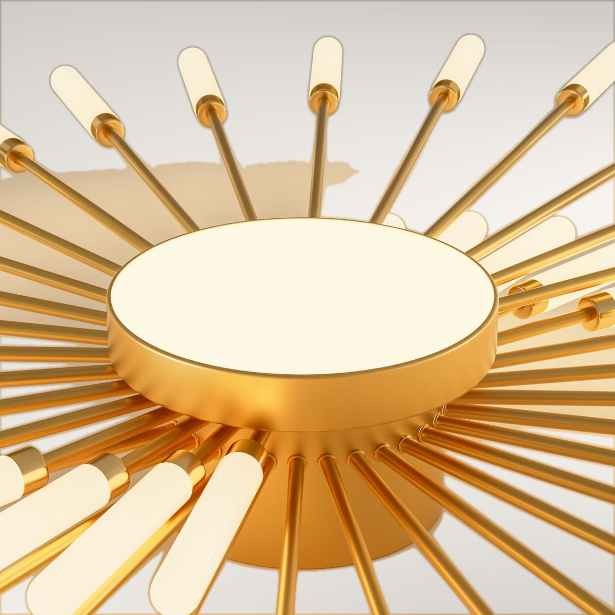 Erges flush ceiling light, the brushed gold hub and its radiating rods.