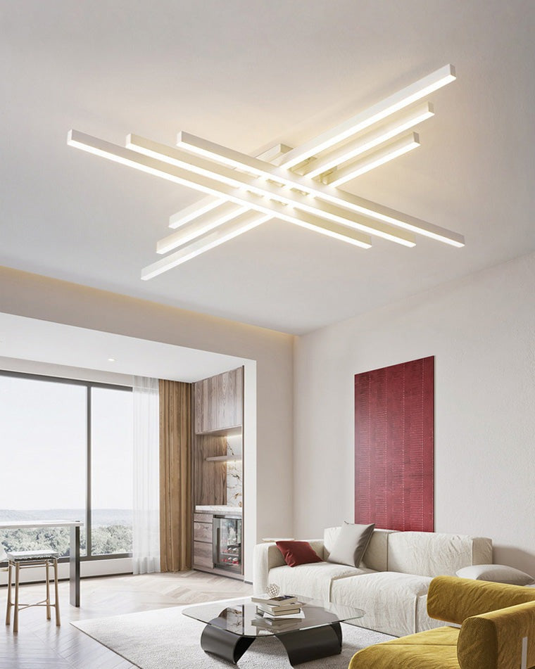 Esposende linear flush mount ceiling light, in a living room, in a white room with red artwork.