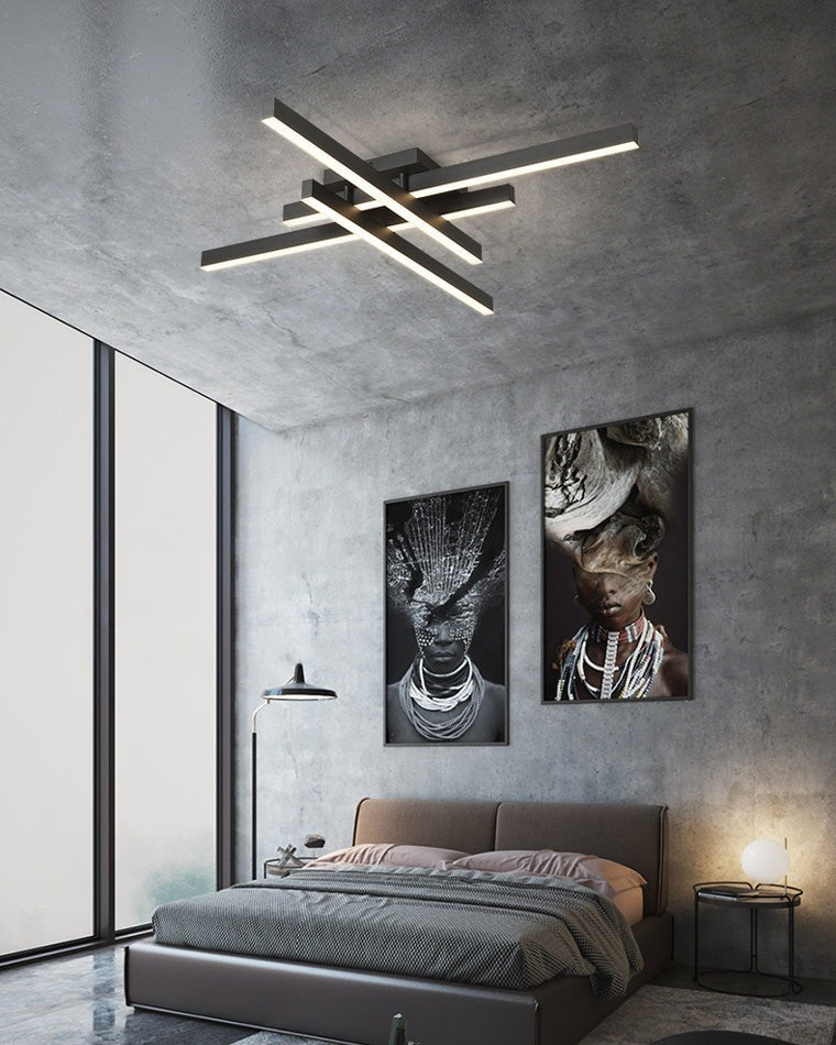 Esposende linear flush mount ceiling light, in a bedroom, against a concrete wall.