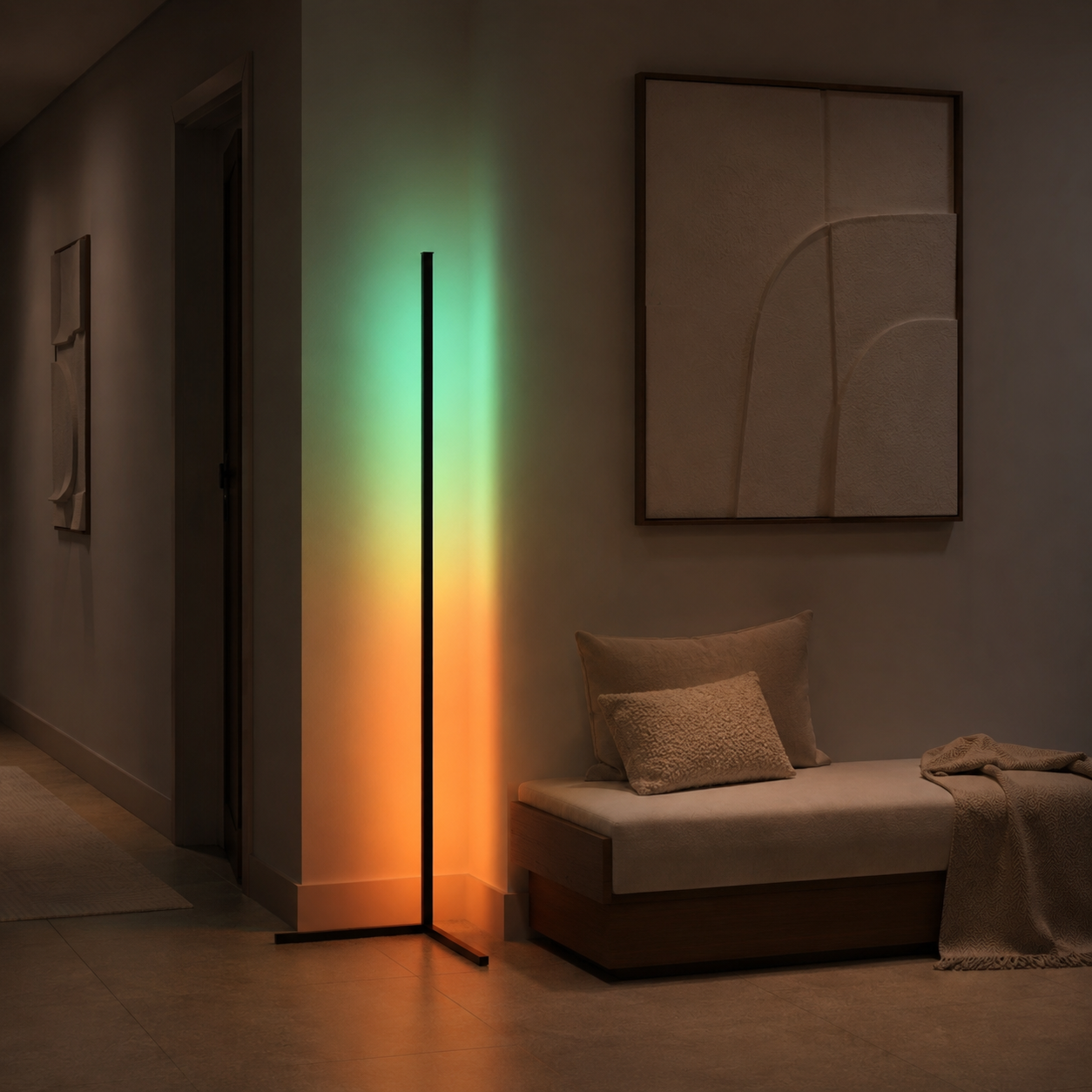 Corner LED floor lamp projecting green and orange light onto hallway walls.