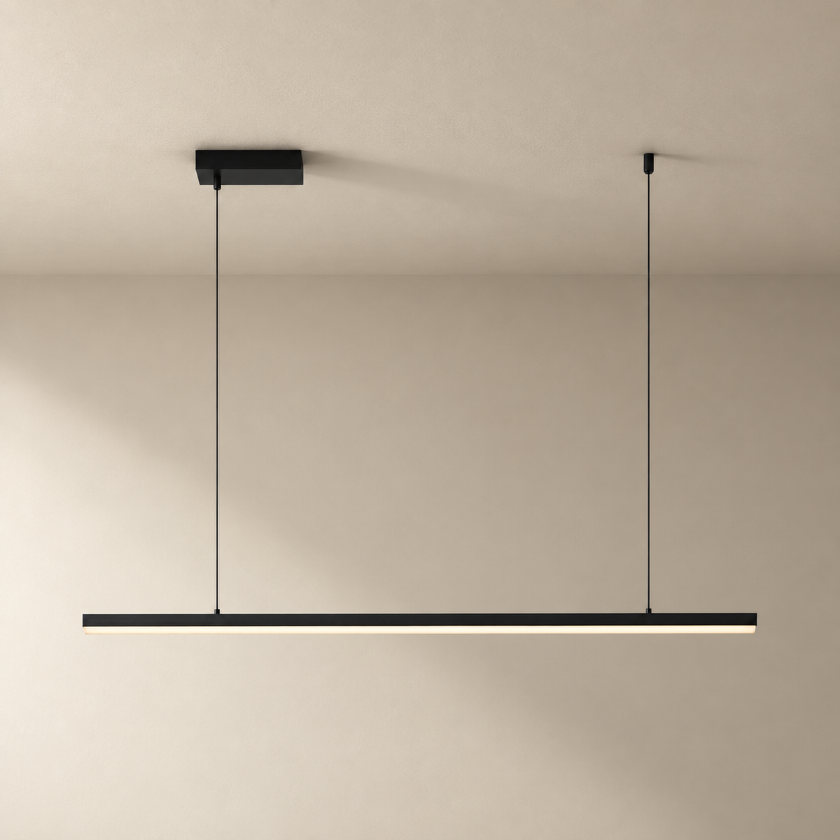 Góis linear LED ceiling light in black, on a plain ceiling.