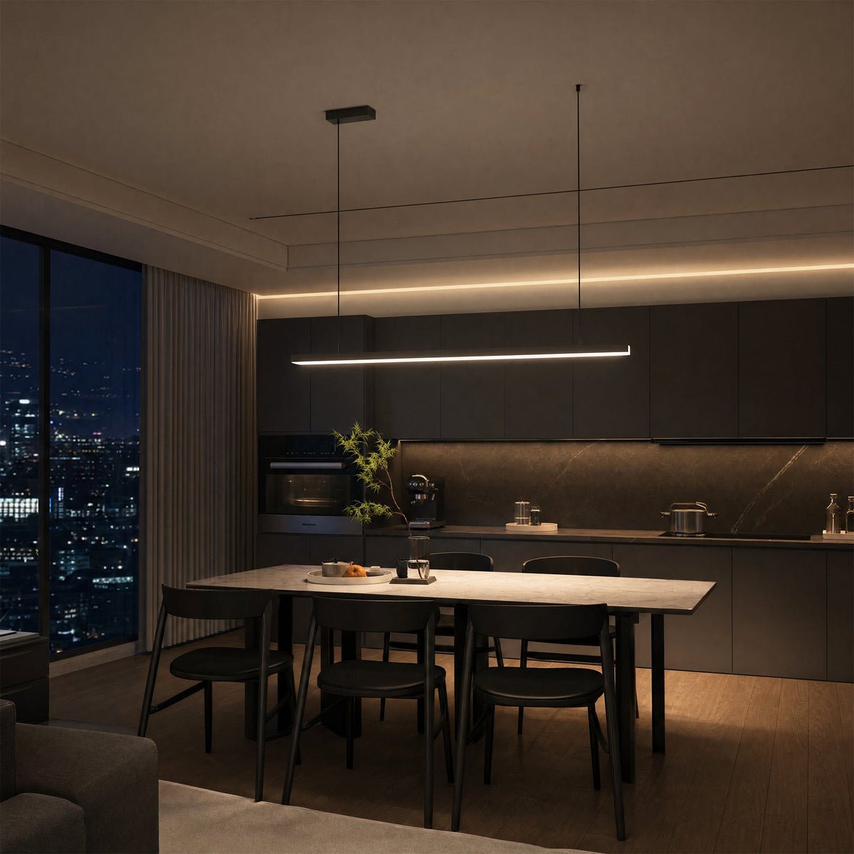 Góis linear LED ceiling light, in a dining room, against a city window at night.