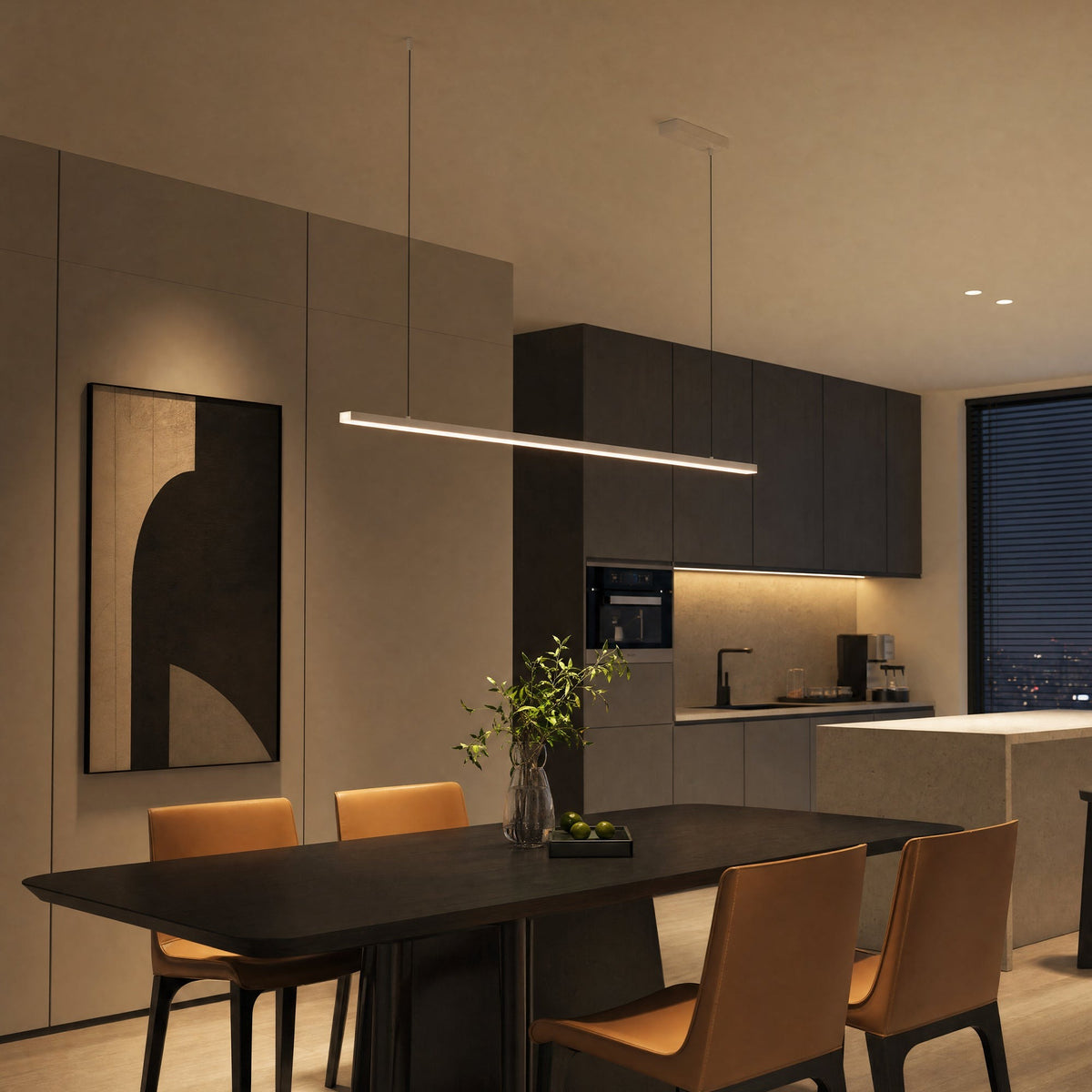 Góis linear LED ceiling light, in a dining room, against a dark green wall.