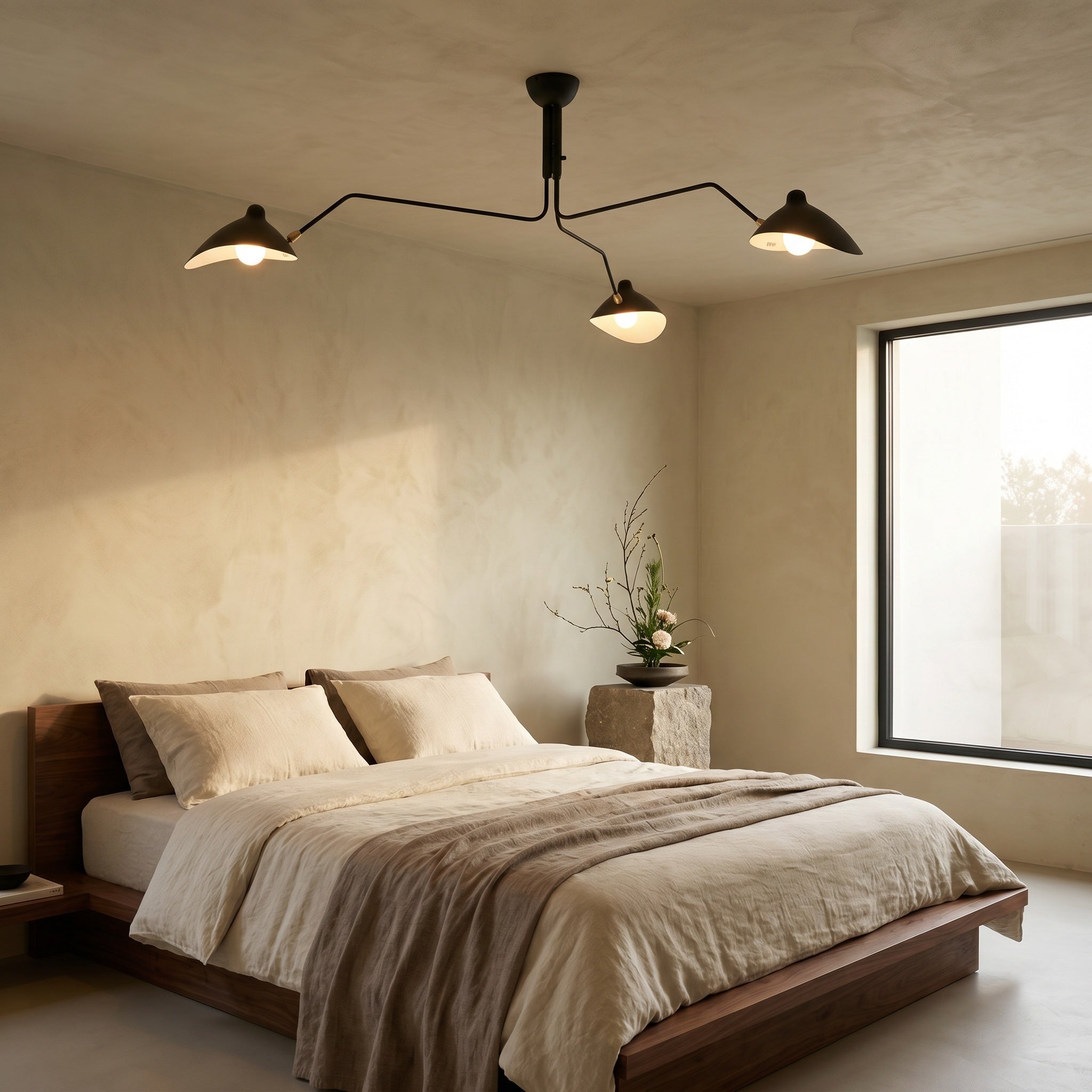 Marvão multi-arm ceiling light with brass hardware lighting a bedroom corner