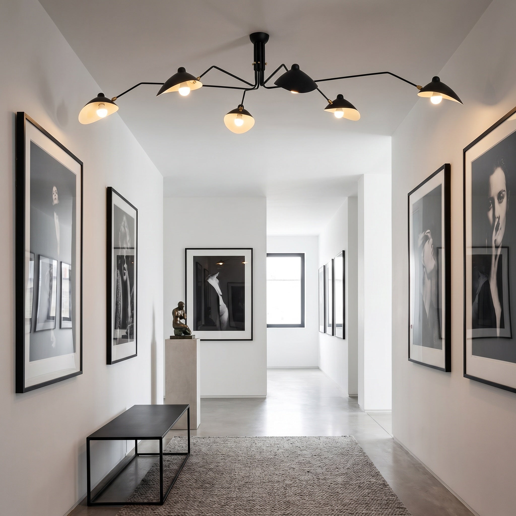 Marvão multi-arm ceiling light with brass hardware in a modern open plan room