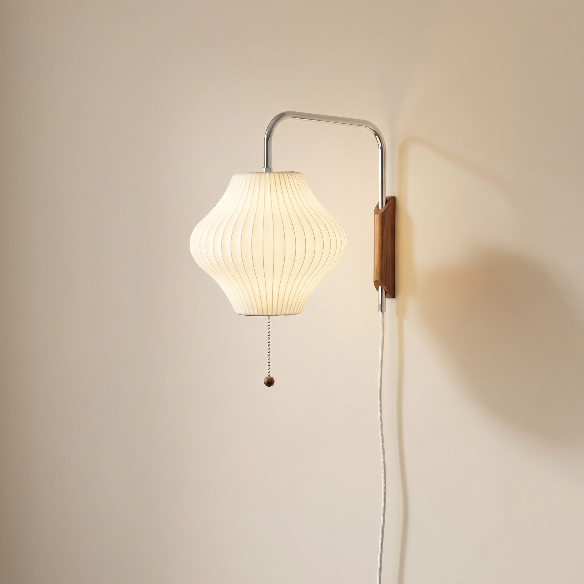 Mirandela globe wall sconce front view, chrome adjustable arm and walnut wood accent