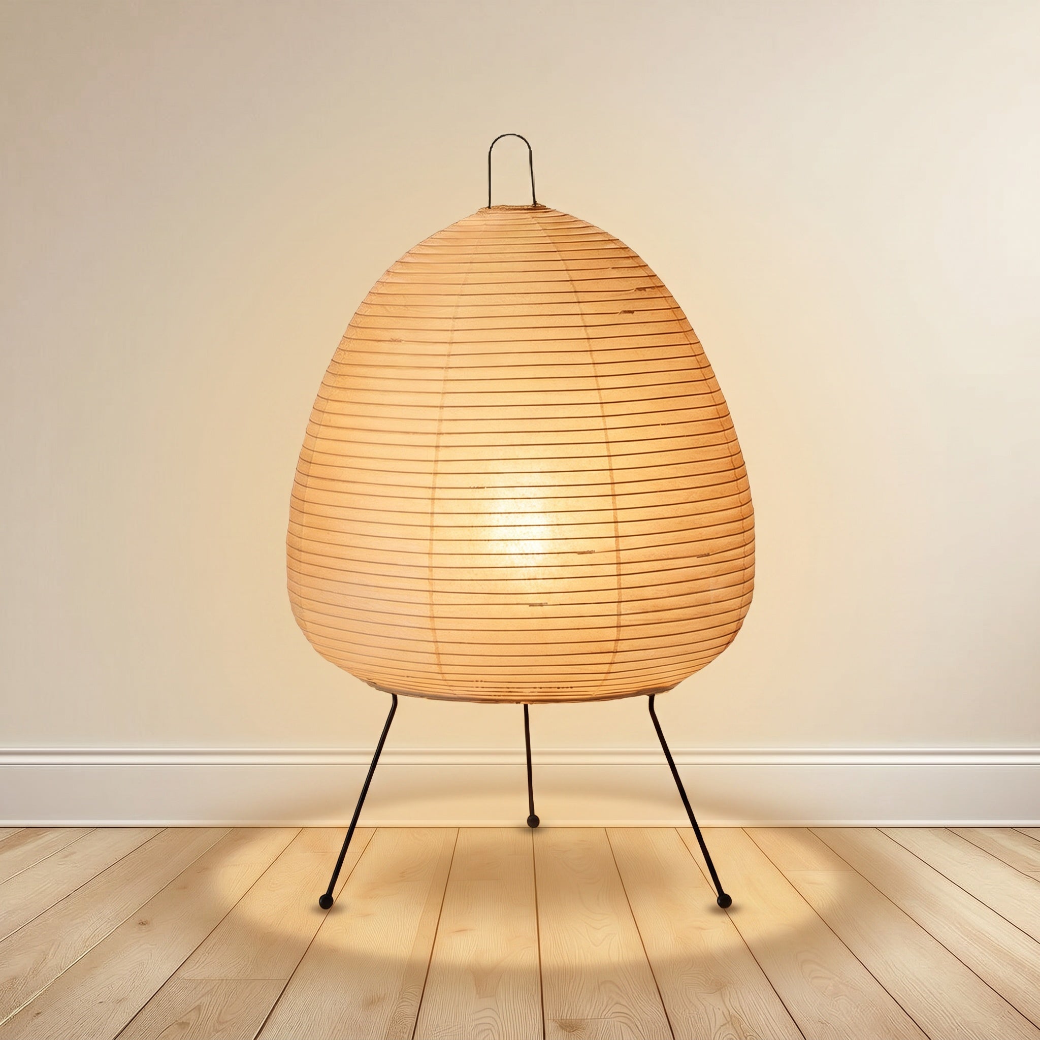 Mulberry paper table lamp, mid-height lantern form, on a black metal tripod.