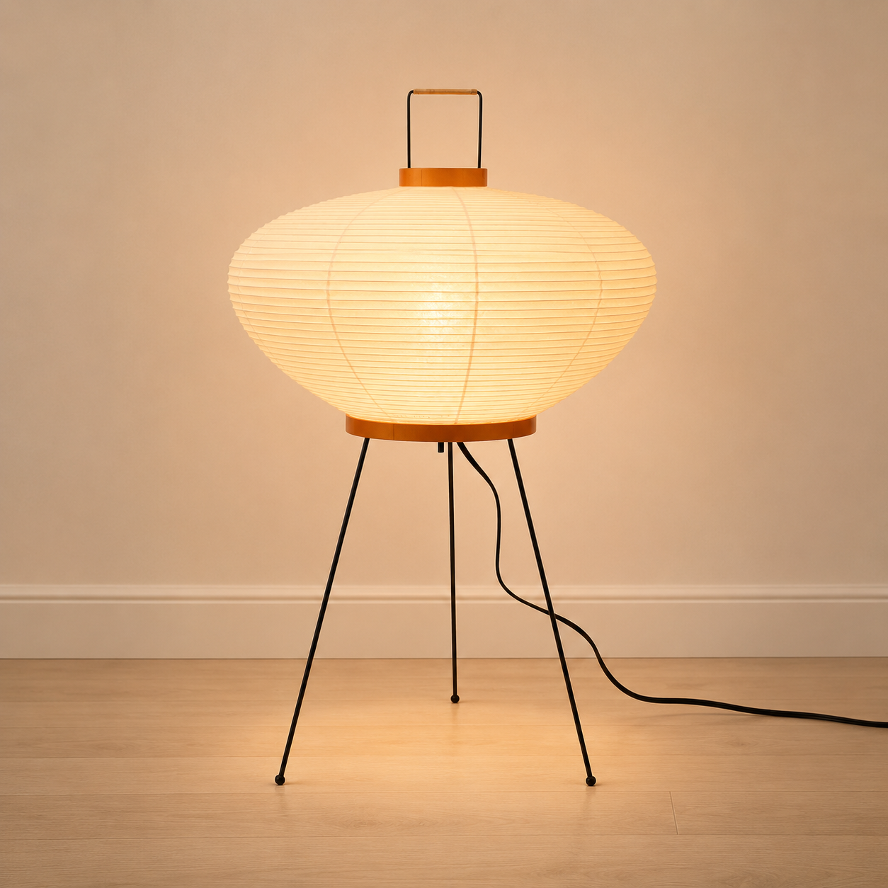 Mulberry paper table lamp, compact form, on a black metal tripod.