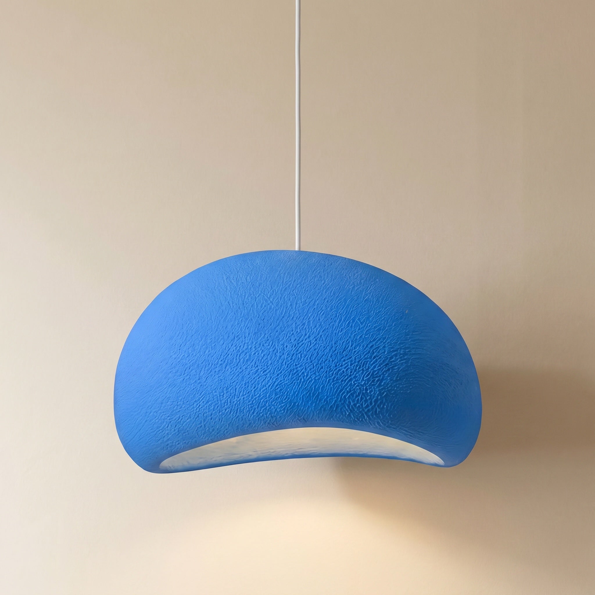 Mosteiros. polystyrene cloud pendant light detail of the plug-in swag cord and ceiling hooks