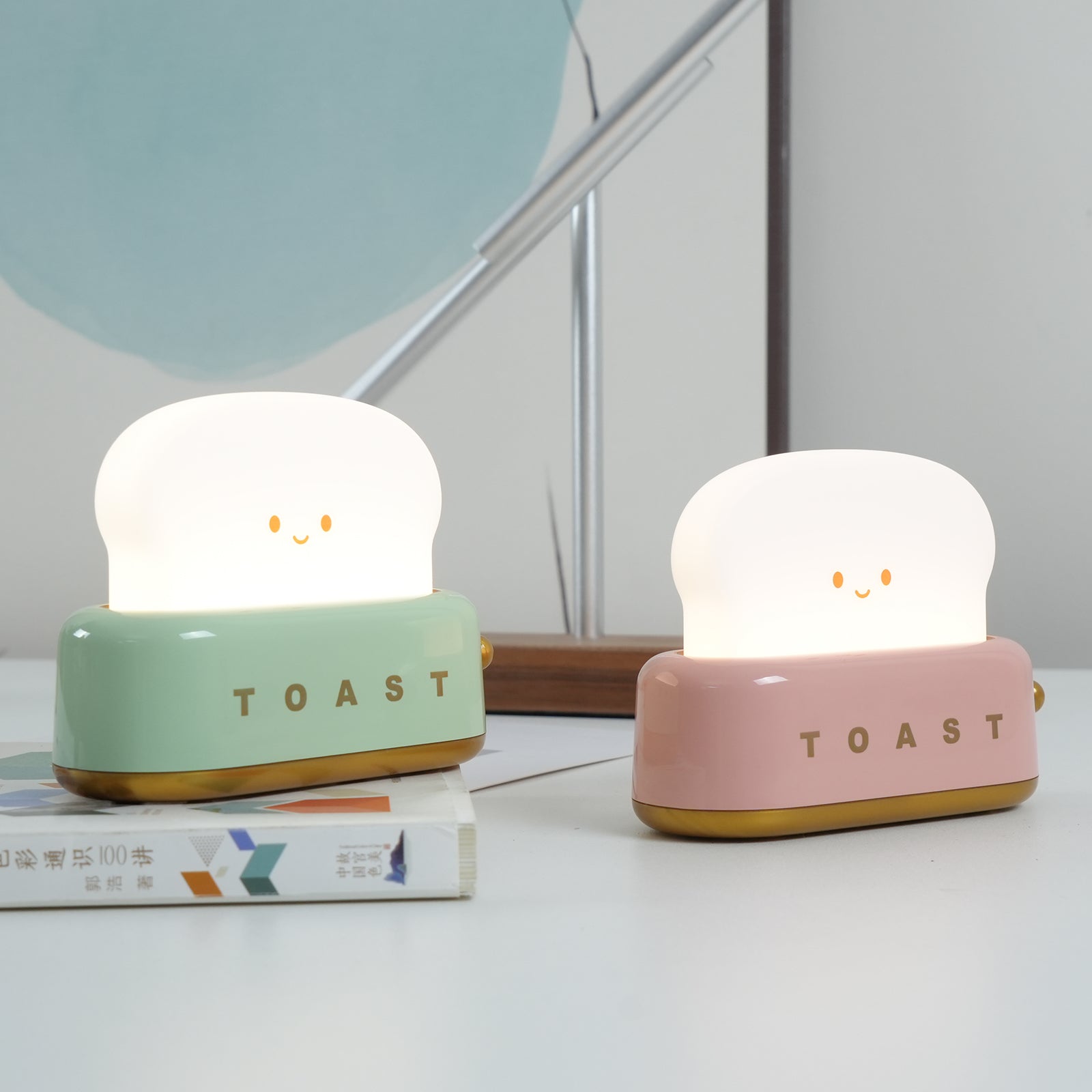 Toaster-shape LED night light close-up showing the smiling toast.