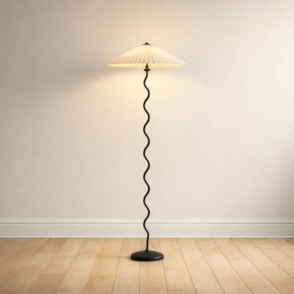 Wavy-stem floor lamp with a beige pleated fabric shade, plain-wall product shot.