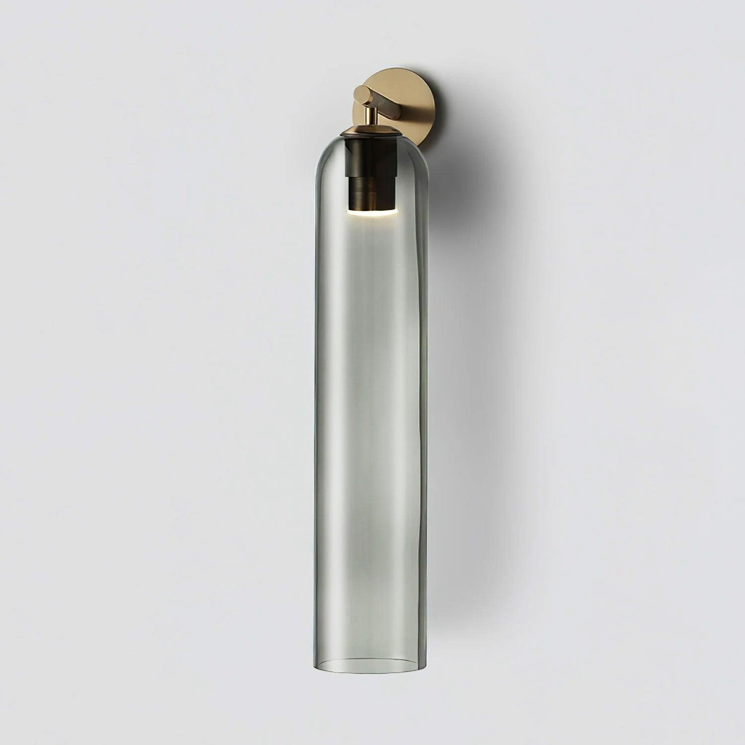 Sortelha wall sconce shown at an angle with iron stem and glass shade