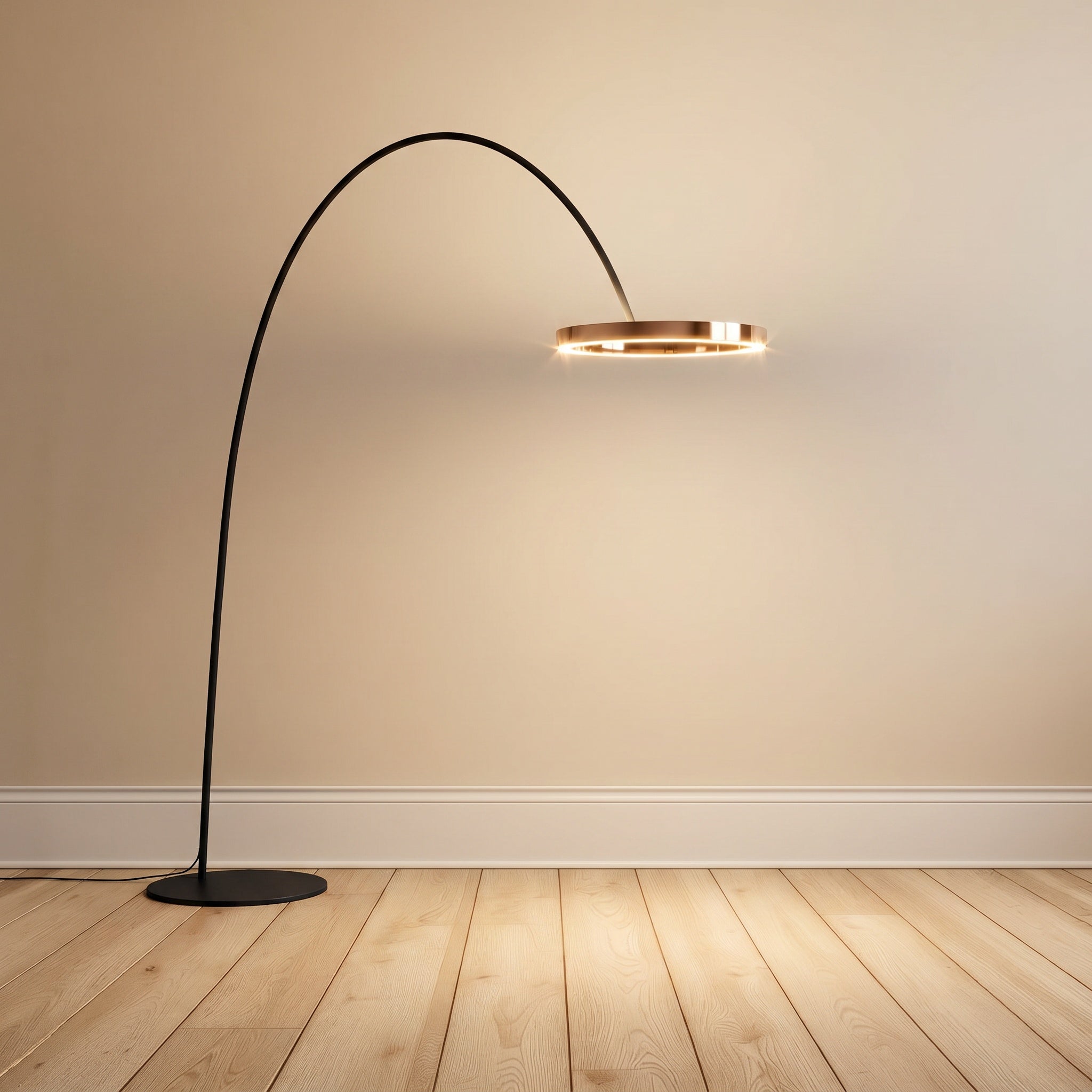 Black arched LED floor lamp with brass-toned ring on a cream wall over wood floors.