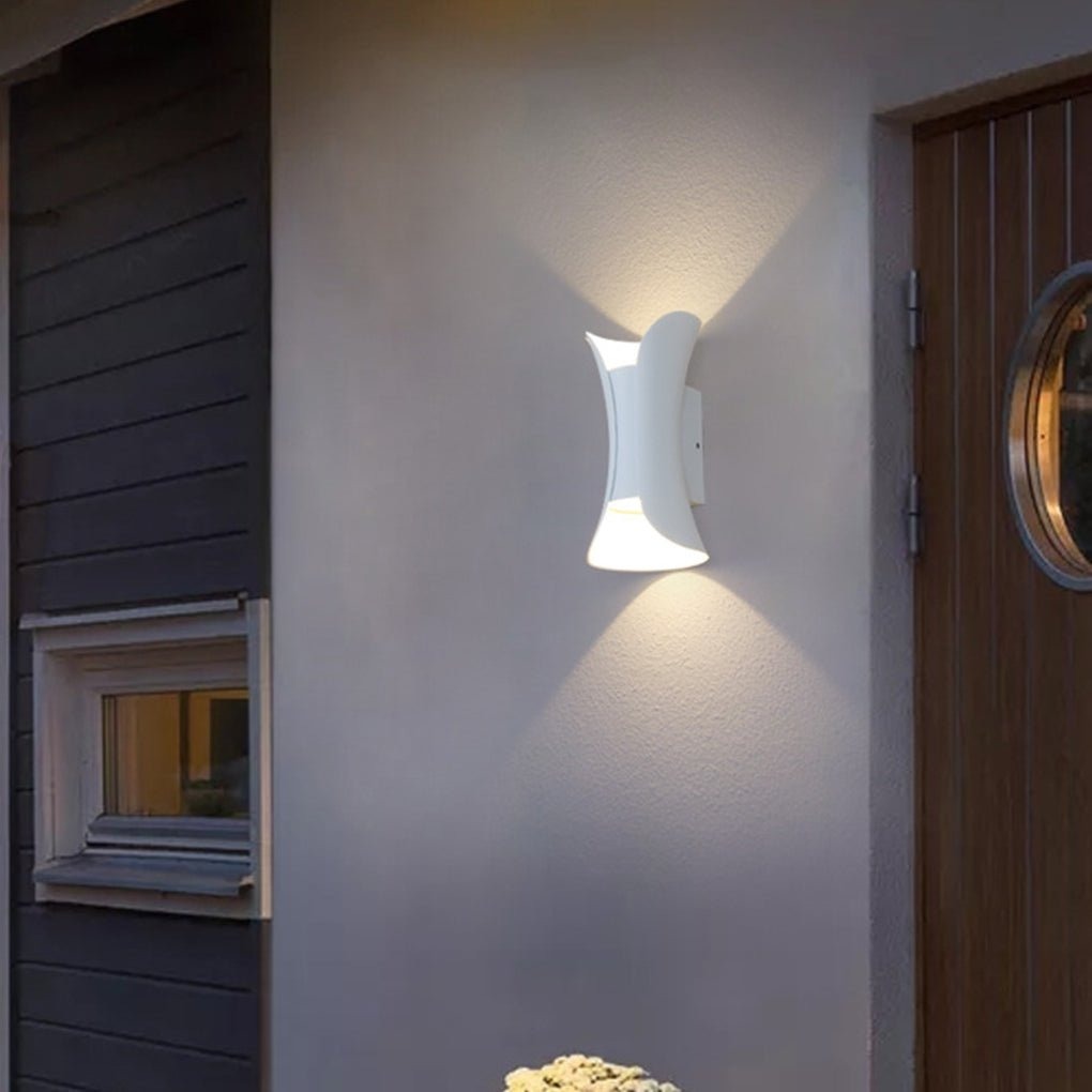 Águeda wall light in interior space showing warm white LED glow and form