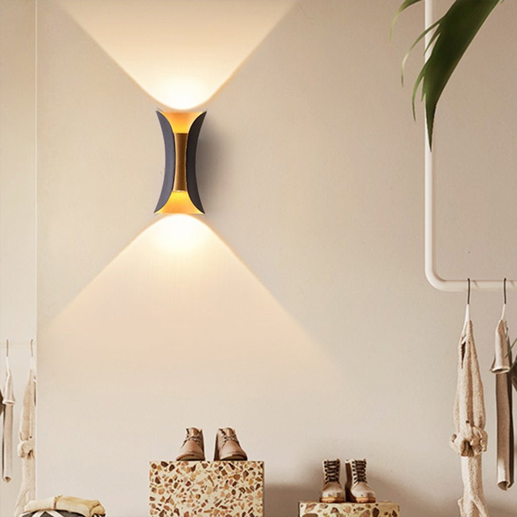 Águeda wall light on patio creating ambient up-down light spread