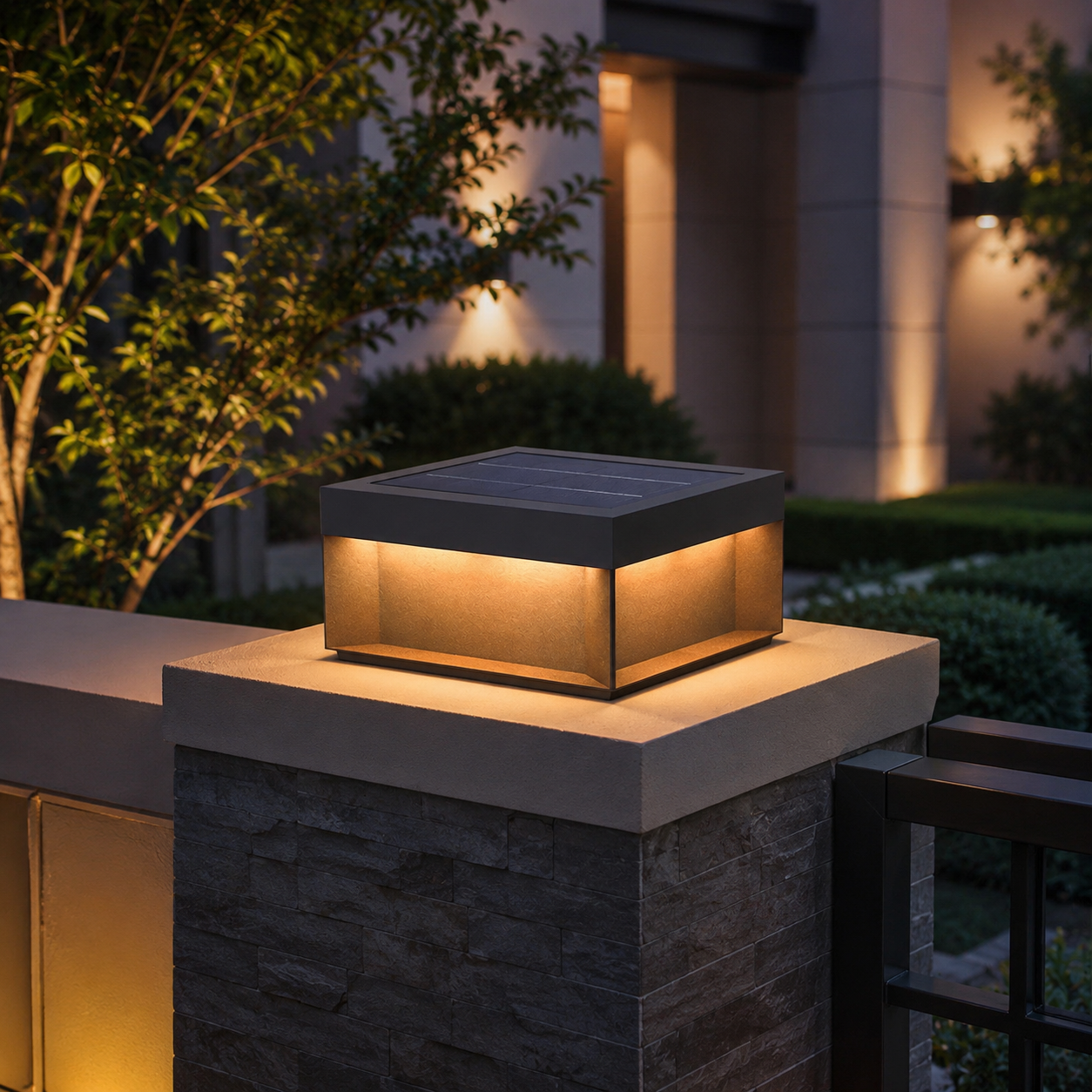 Alcacer solar box light on stone pillar at dusk, framed by tree and lit columns