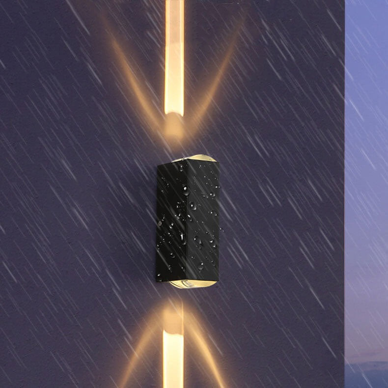 Alcobaça wall sconce mounted showing warm light output