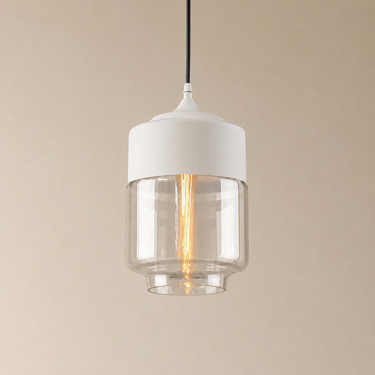 Alge glass pendant with a white cap and a clear glass shade, a shorter, wider upright cylinder measuring 28 by 18 cm