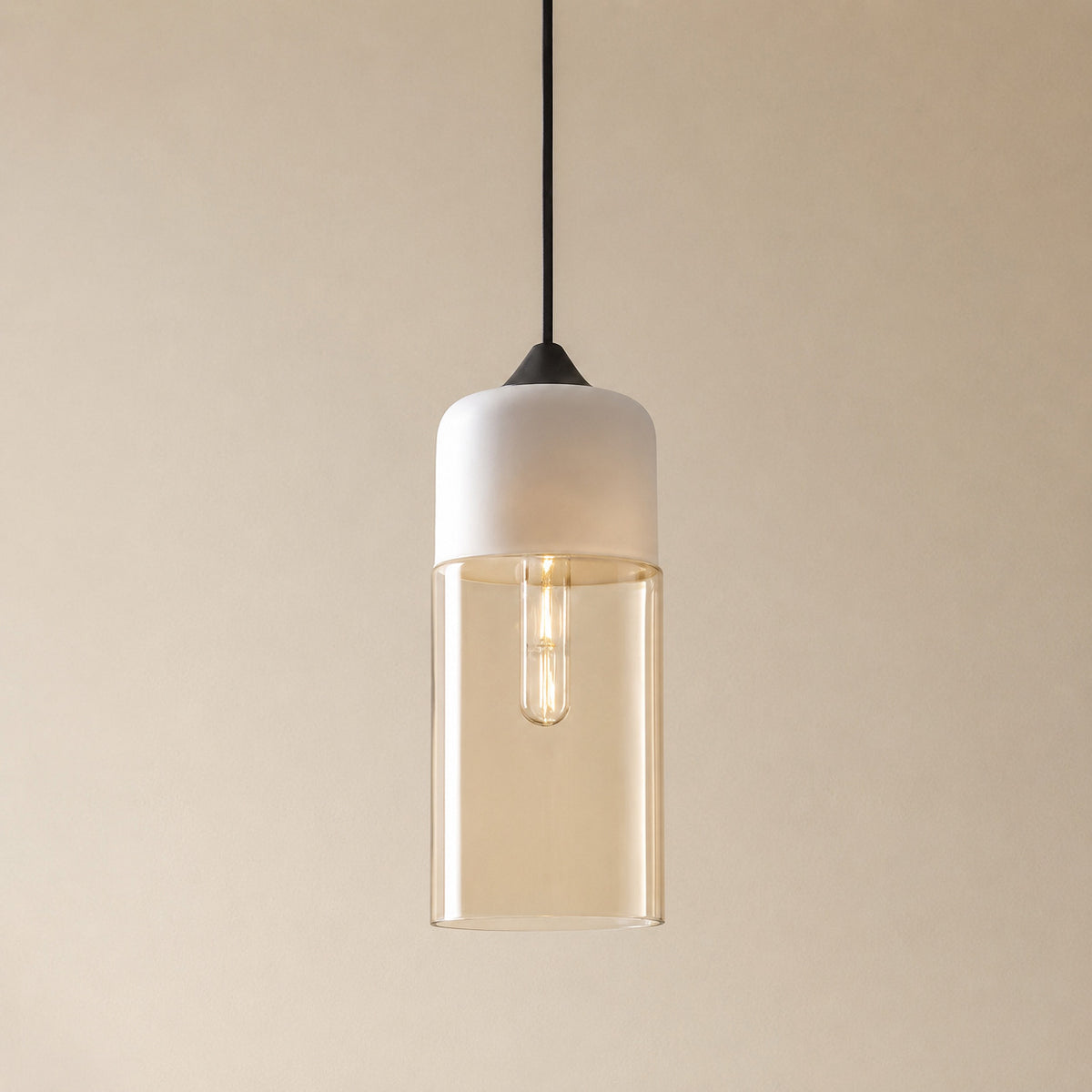 Alge glass pendant with a white cap and an amber glass shade, a tall narrow cylinder measuring 33 by 13 cm