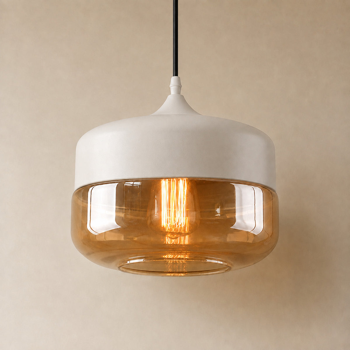 Alge glass pendant with a white cap and an amber glass shade, a wide shallow drum