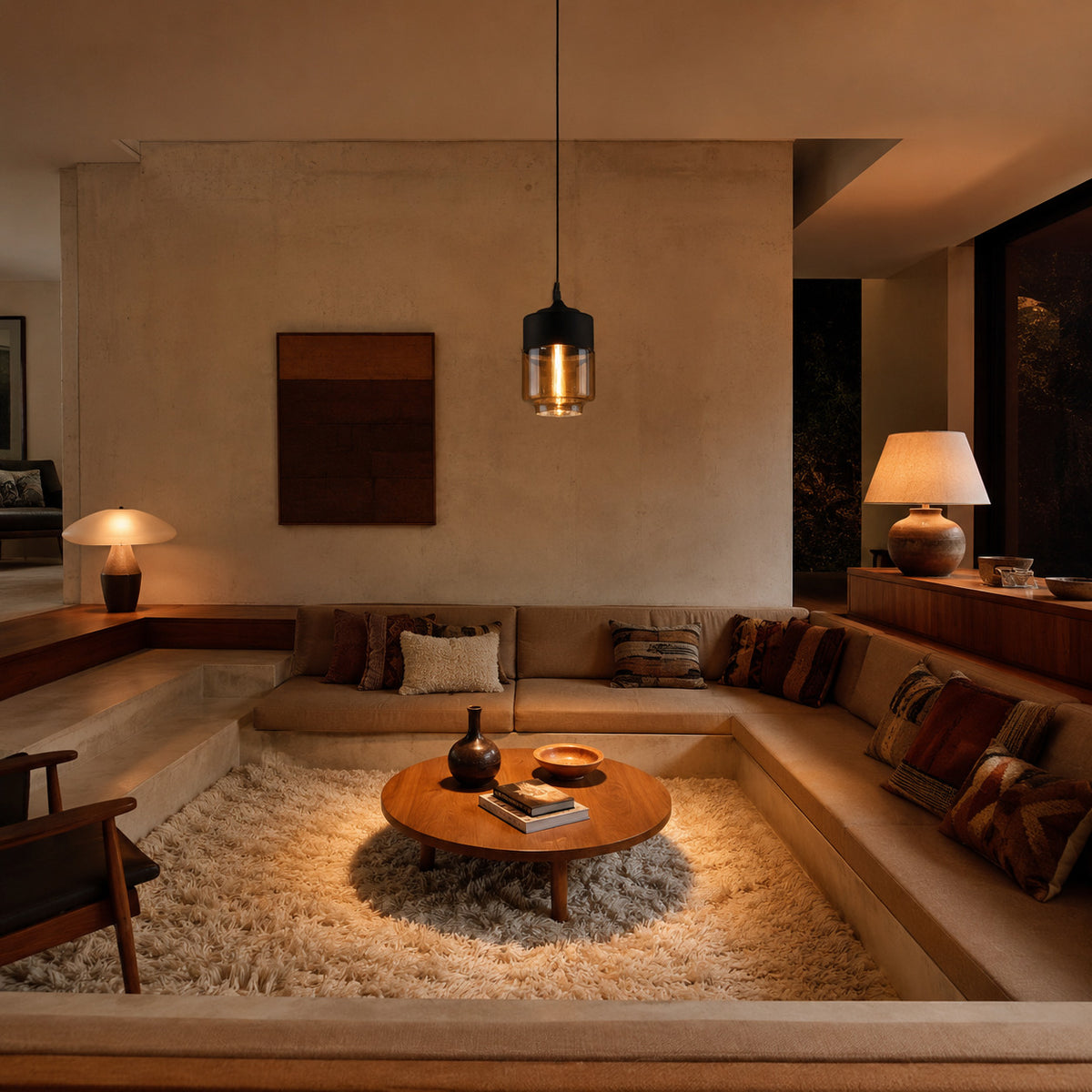 Alge pendant in black and amber, upright cylinder shape, above a sunken mid century living room