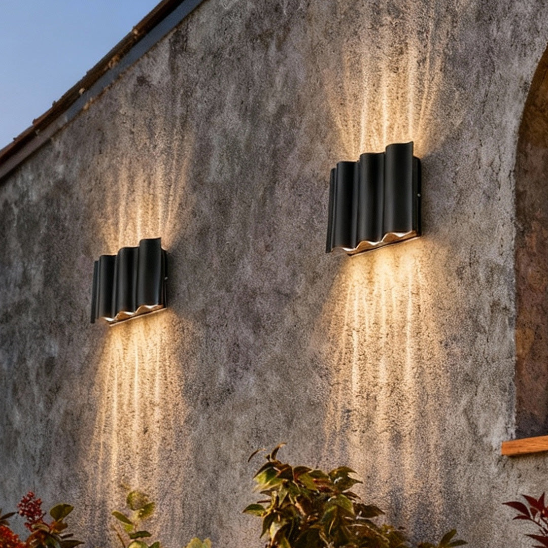 Almeida outdoor wall sconce in black, wavy aluminum, 4-light configuration