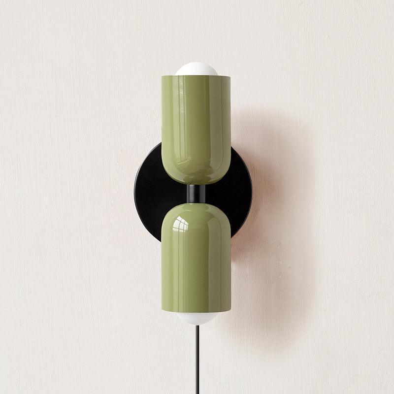 Alvor wall sconce in green painted metal, both up and down shades shown from the front