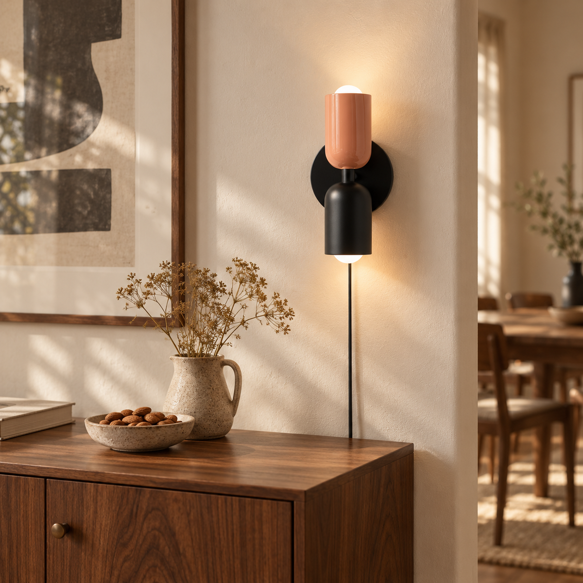 Alvor up-and-down plug-in wall sconce in beige, in a dining room.