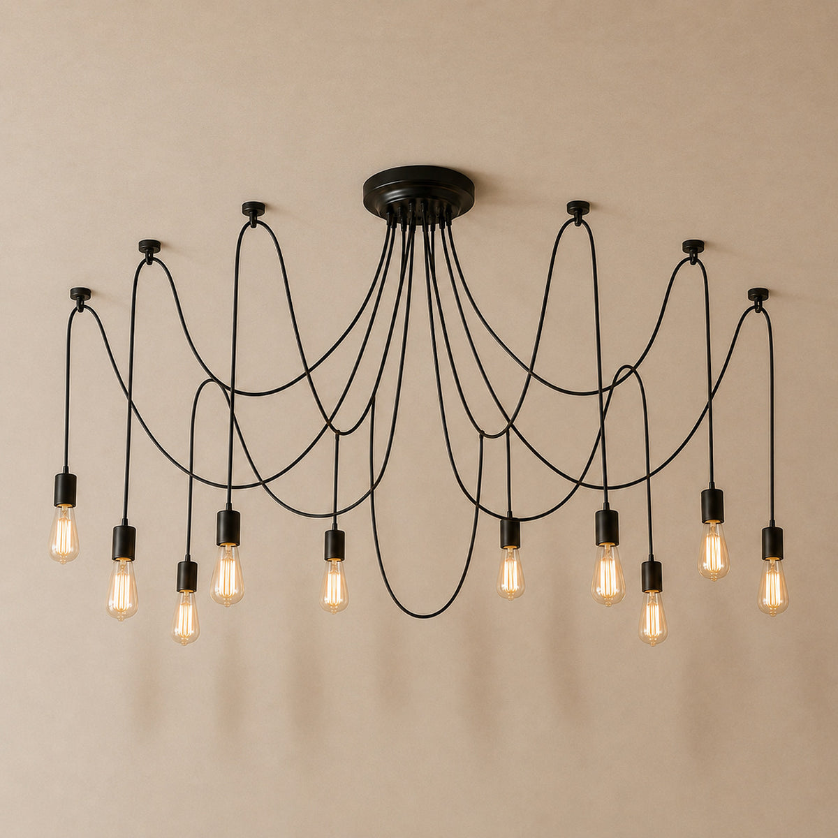 Anadia spider chandelier in matte black, 10 cable version, ten bare Edison bulbs on one ceiling plate