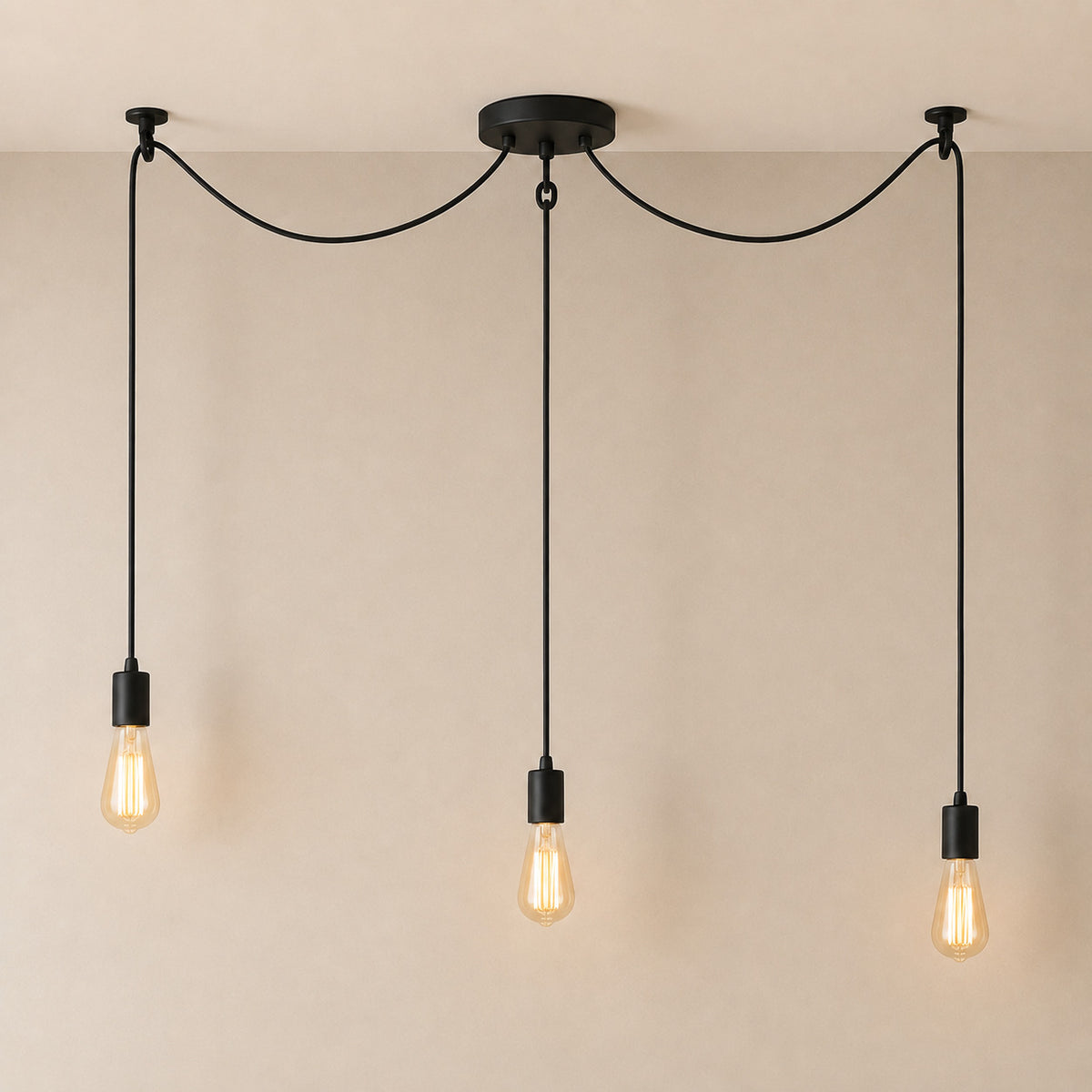 Anadia spider chandelier in matte black, 3 cable version, three bare Edison bulbs on one ceiling plate
