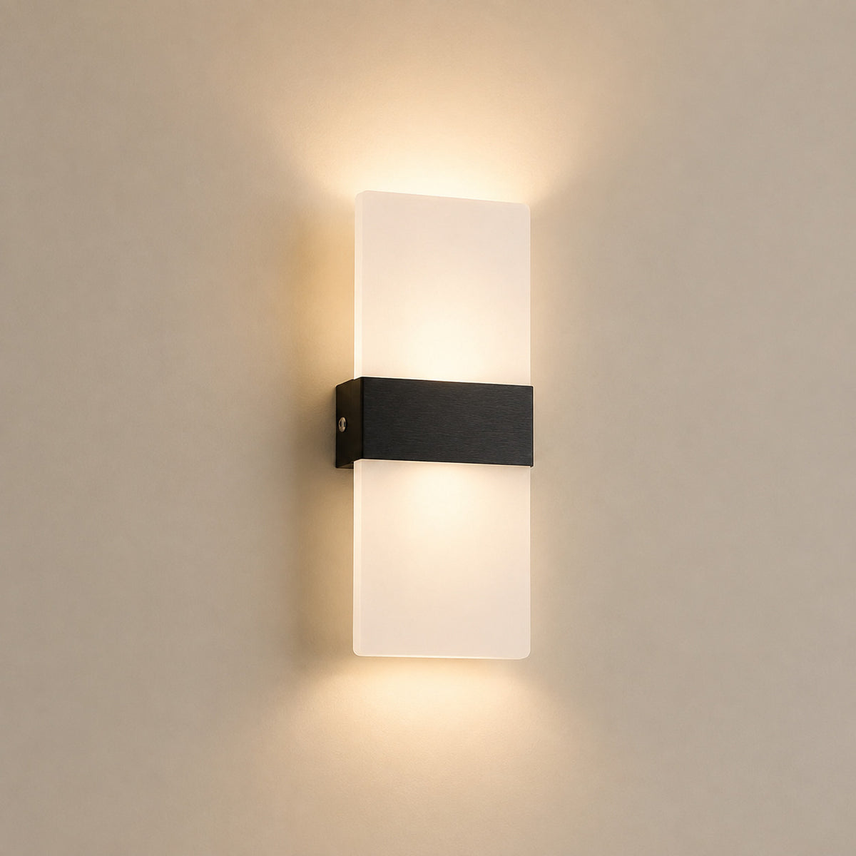 Anços strip LED wall sconce with a black band on a frosted acrylic panel, warm white light