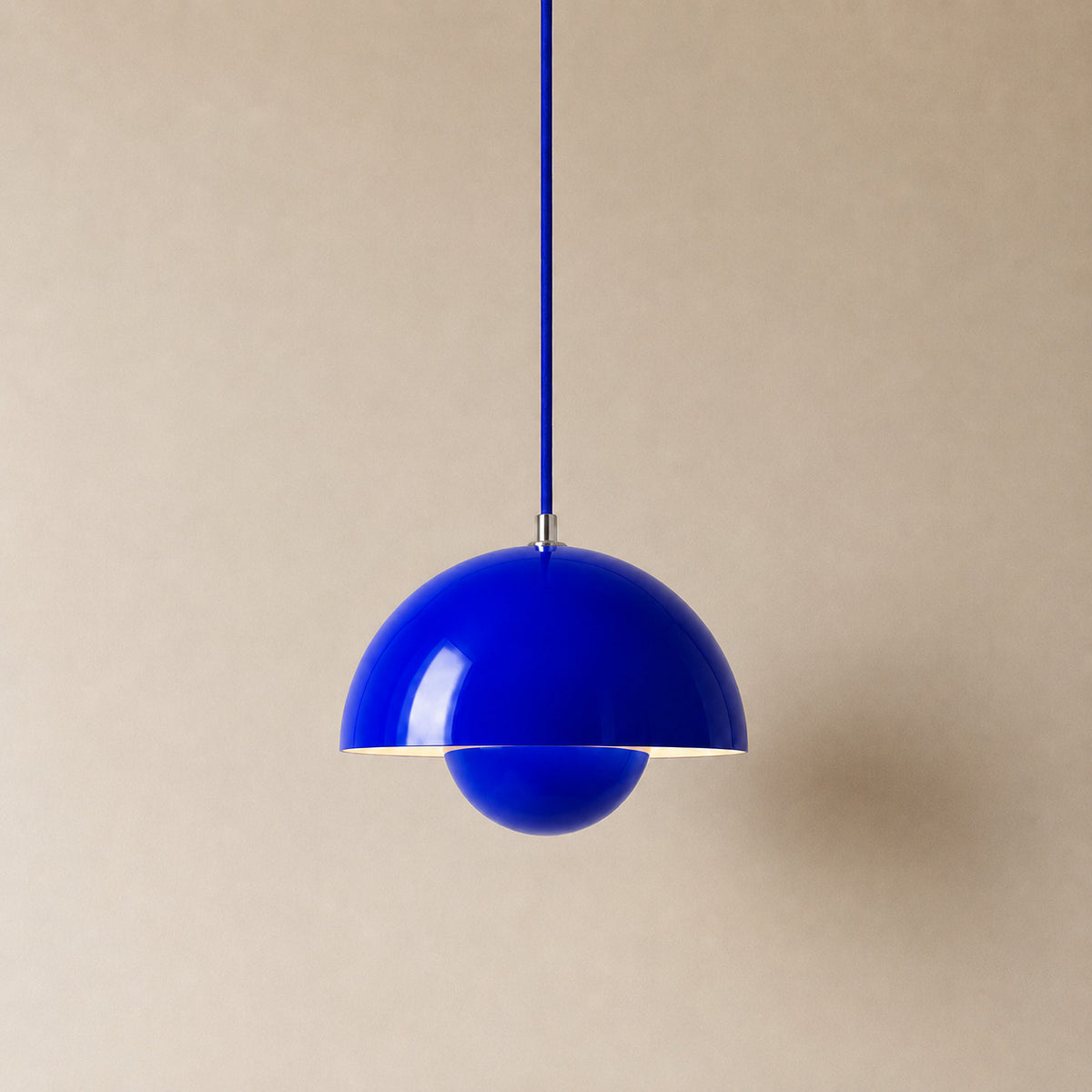 Ave hemisphere pendant in klein blue on a matching fabric cord, 16 cm tall