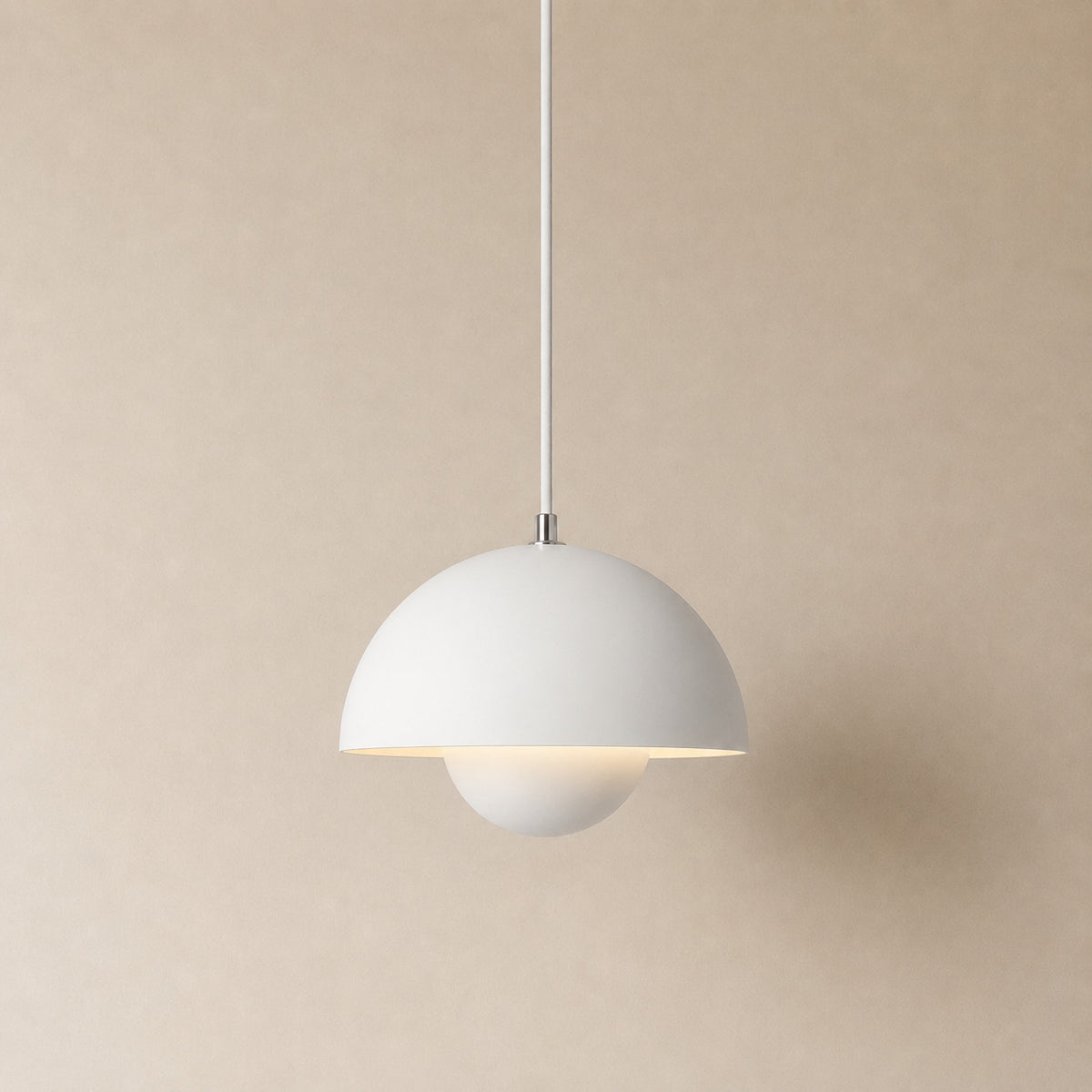 Ave hemisphere pendant in matte white on a matching fabric cord, 16 cm tall